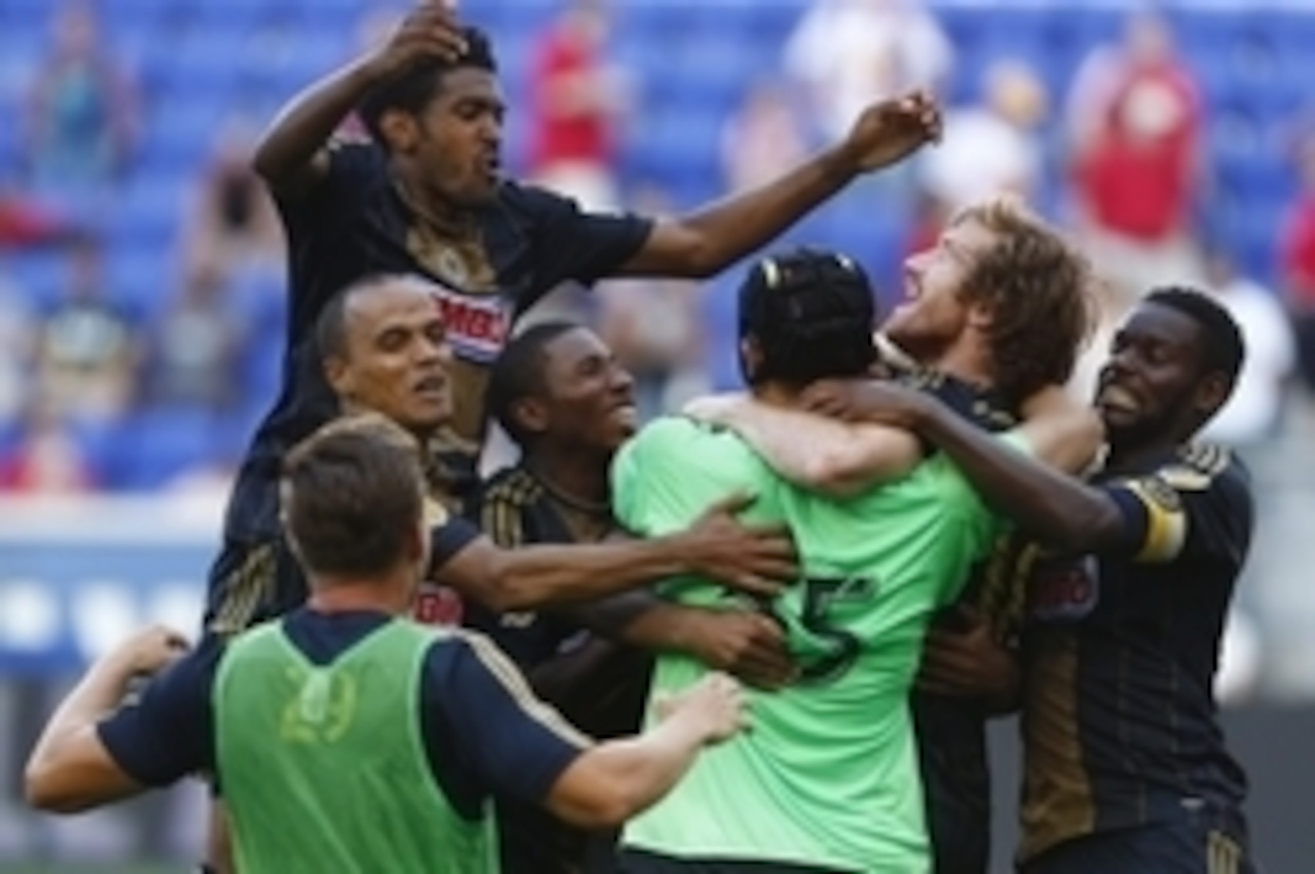 Jul 21, 2015; Harrison, NJ, USA; Philadelphia Union forward Fernando Aristeguieta (second from right) is congratulated by his teammates as they celebrate his game winning goal to end penalty kicks against NY Red Bulls during a quarterfinal match of the US