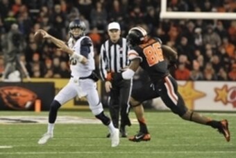 Nov 1, 2014; Corvallis, OR, USA; California Golden Bears quarterback Jared Goff (16) runs the ball to pass as Oregon State Beavers defensive end Obum Gwacham (86) runs after him in the first quarter at Reser Stadium. Mandatory Credit: Susan Ragan-USA TODA