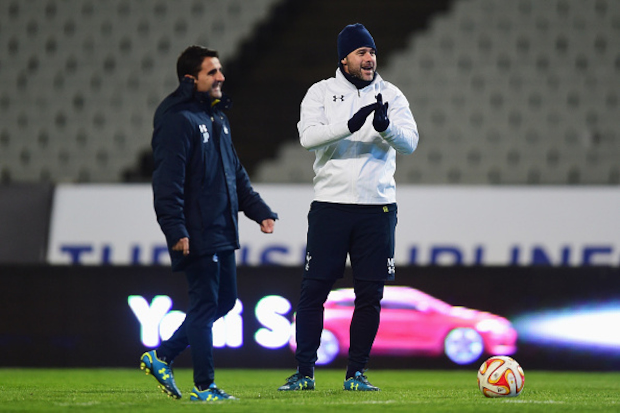 ISTANBUL, TURKEY - DECEMBER 10:  Mauricio Pochettino manager of Spurs (R) jokes with assistant head coach Jesus Perez look on during a Tottenham Hotspur training session, ahead of the UEFA Europa League Group C match, against Beskitas JK at Ataturk Olympi