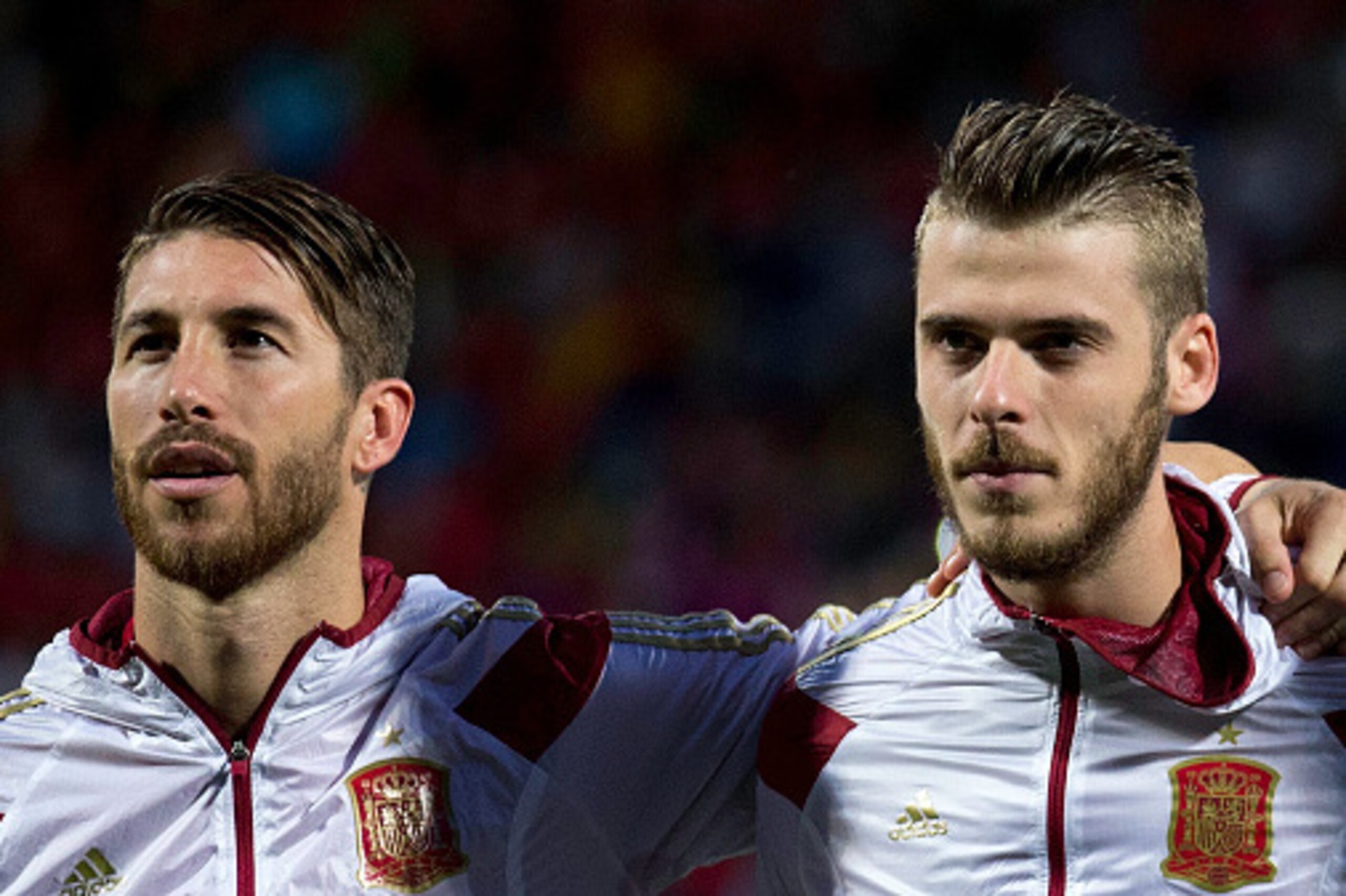 LEON, SPAIN - JUNE 11: Goalkeeper David de Gea (R) of Spain listen to the Spanish national anthem embraced to his teammate Sergio Ramos (R) during the international friendly match between Spain and Costa Rica at Reino de Leon Stadium on June 11, 2015 in L