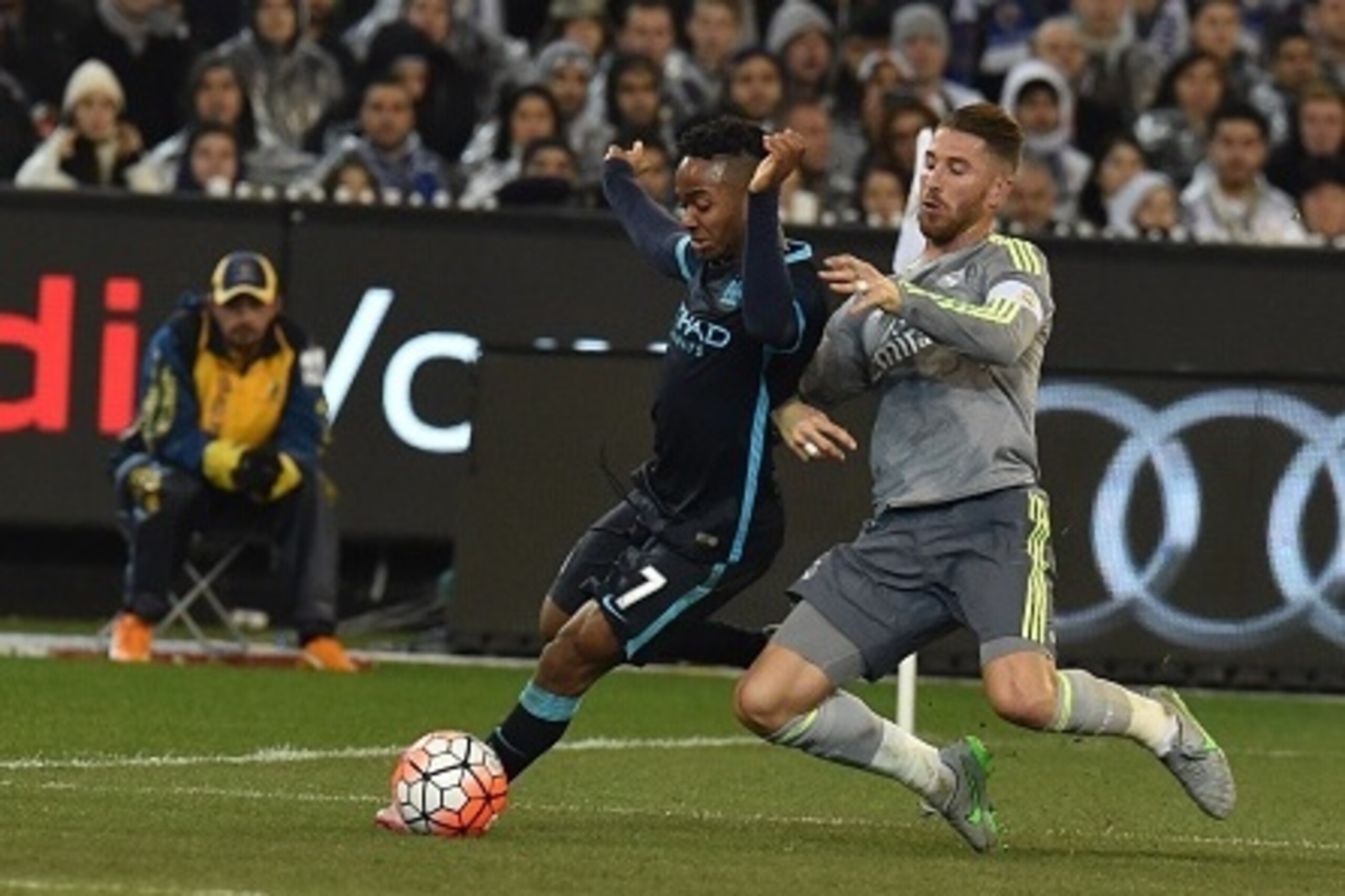 Manchester City midfielder Raheem Sterling (L) fights for the ball with Real Madrid's Sergio Ramos (R) during the International Champions Cup football match between English Premier League team Manchester City and Spanish side Real Madrid in Melbourne on J