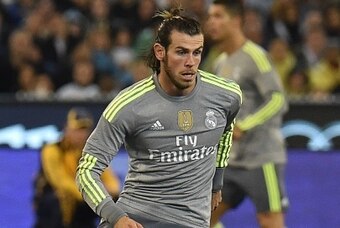 Real Madrid's Gareth Bale runs with the ball during the International Champions Cup Australia football match between English Premier League team Manchester City and Spanish side Real Madrid in Melbourne on July 24, 2015. Real Madrid won the match 4-1. AFP