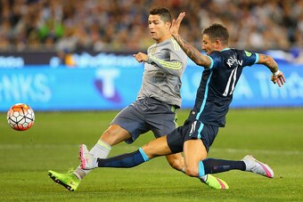 MELBOURNE, AUSTRALIA - JULY 24:  Cristiano Ronaldo of Real Madrid scores a goal infront of Aleksandar Kolarov of Manchester City during the International Champions Cup match between Real Madrid and Manchester City at Melbourne Cricket Ground on July 24, 2