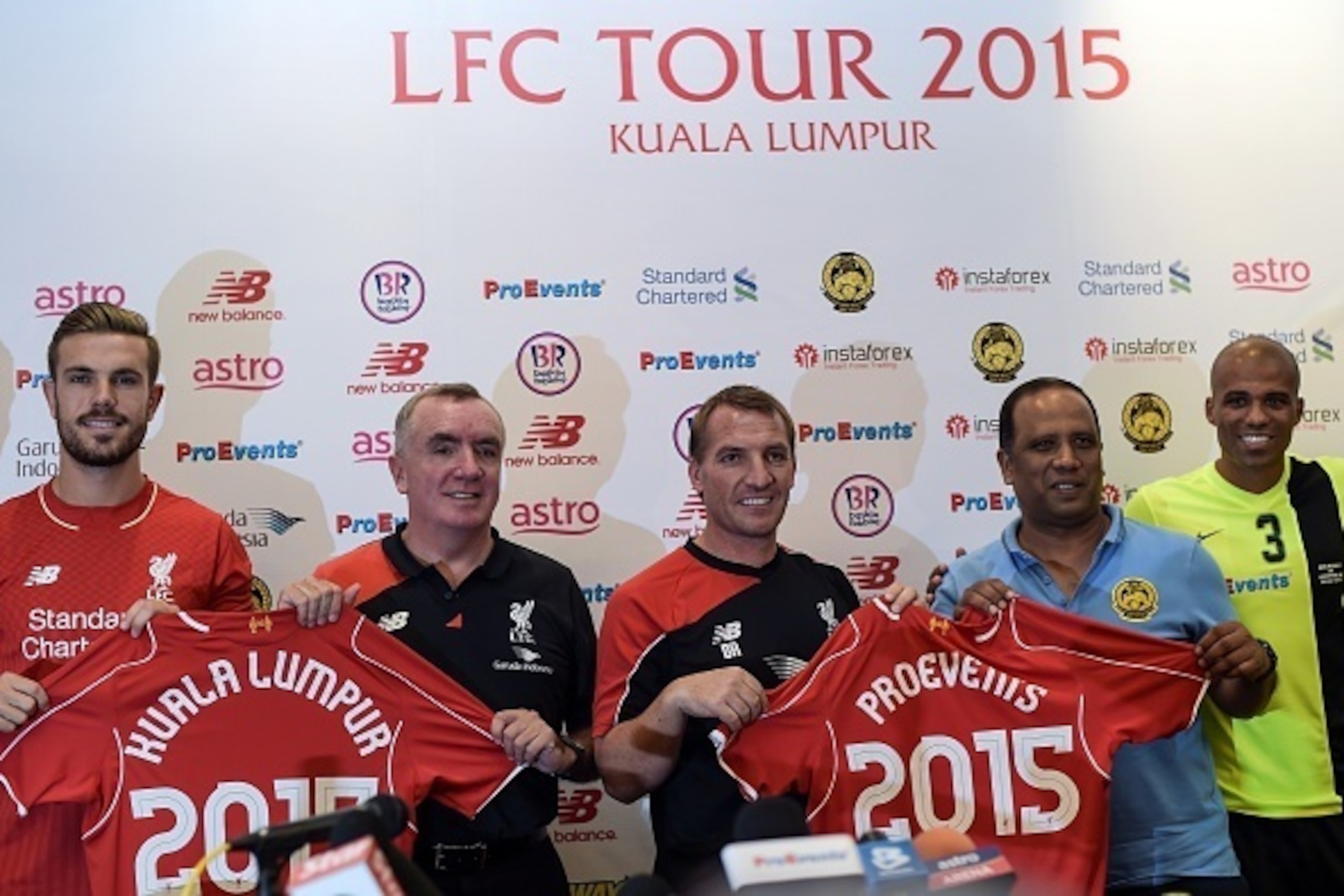 Liverpool's English midfielder Jordan Henderson (L), Liverpool's CEO Ian Ayre (2nd L), Northern Irish manager Brendan Rodgers (C), Malaysia's football coach Dollah Saleh (2nd R) and Malaysia's defender Thiago Junio de Aquino (R) pose after a press confere Liverpool's English midfielder Jordan Henderson (L), Liverpool's CEO Ian Ayre (2nd L), Northern Irish manager Brendan Rodgers (C), Malaysia's football coach Dollah Saleh (2nd R) and Malaysia's defender Thiago Junio de Aquino (R) pose after a press confere