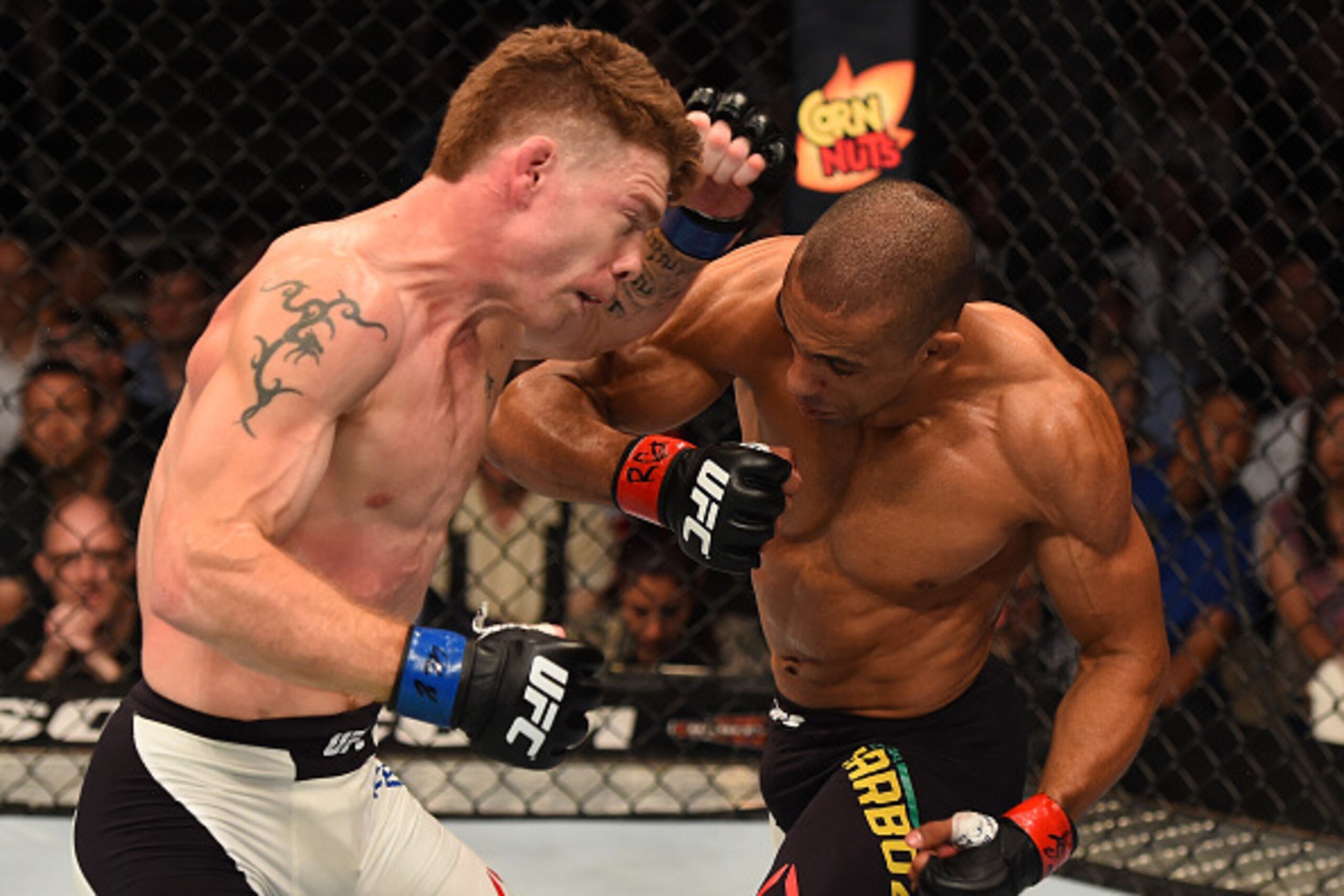 CHICAGO, IL - JULY 25: (R-L) Edson Barboza of Brazil punches Paul Felder in their lightweight bout during the UFC event at the United Center on July 25, 2015 in Chicago, Illinois. (Photo by Jeff Bottari/Zuffa LLC/Zuffa LLC via Getty Images) CHICAGO, IL - JULY 25: (R-L) Edson Barboza of Brazil punches Paul Felder in their lightweight bout during the UFC event at the United Center on July 25, 2015 in Chicago, Illinois. (Photo by Jeff Bottari/Zuffa LLC/Zuffa LLC via Getty Images)