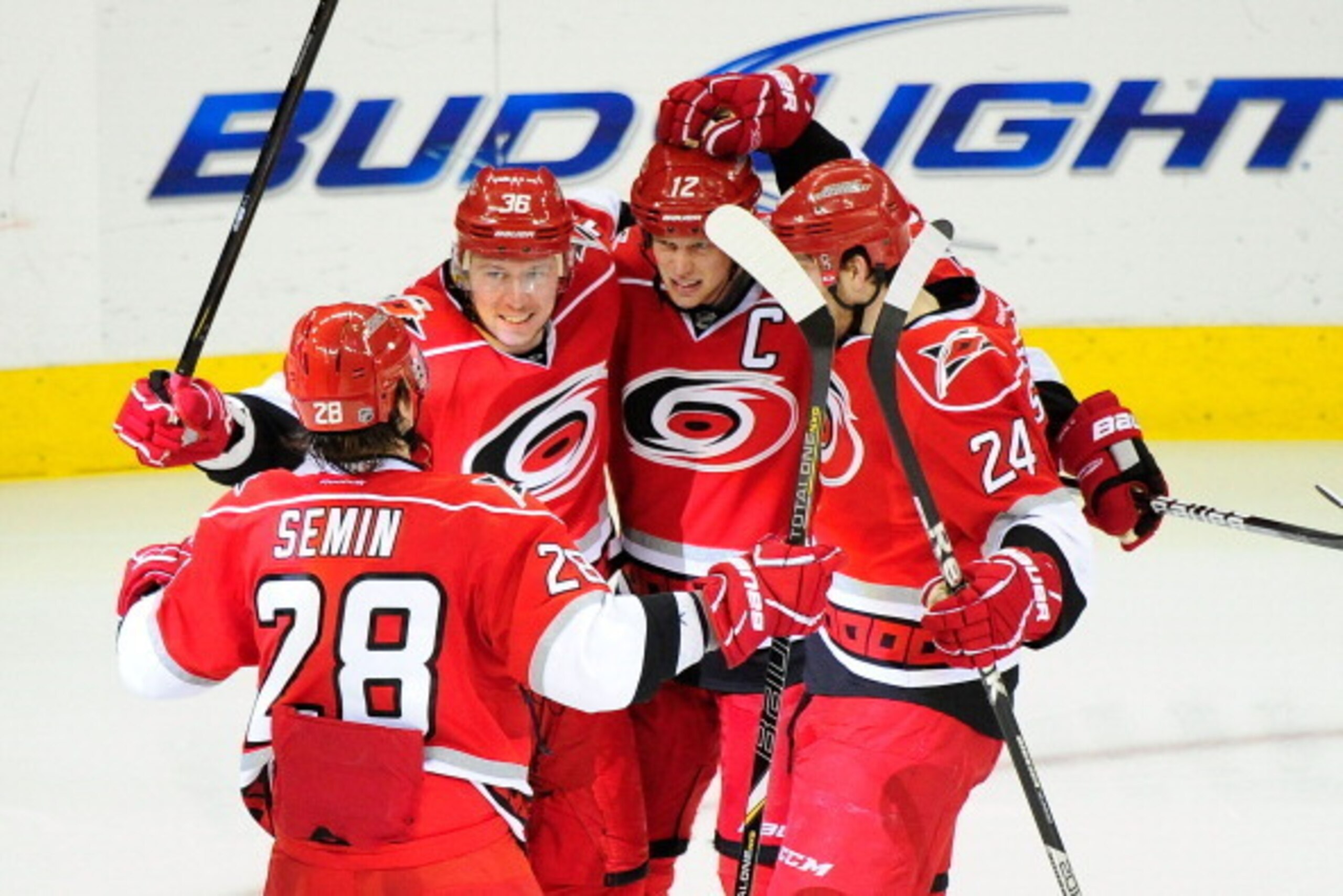 RALEIGH, NC - MARCH 05:  (L-R) Alexander Semin #28, Jussi Jokinen #36, Eric Staal #12 and Bobby Sanguinetti #24 of the Carolina Hurricanes celebrate Jokinen's goal against the Buffalo Sabres during the third period at PNC Arena on March 5, 2013 in Raleigh