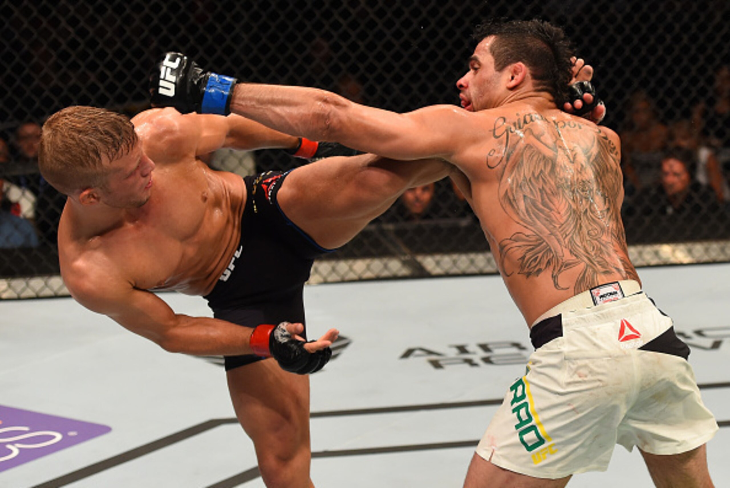 CHICAGO, IL - JULY 25: (L-R) TJ Dillashaw kicks Renan Barao of Brazil in their UFC bantamweight championship bout during the UFC event at the United Center on July 25, 2015 in Chicago, Illinois. (Photo by Jeff Bottari/Zuffa LLC/Zuffa LLC via Getty Image CHICAGO, IL - JULY 25: (L-R) TJ Dillashaw kicks Renan Barao of Brazil in their UFC bantamweight championship bout during the UFC event at the United Center on July 25, 2015 in Chicago, Illinois. (Photo by Jeff Bottari/Zuffa LLC/Zuffa LLC via Getty Image