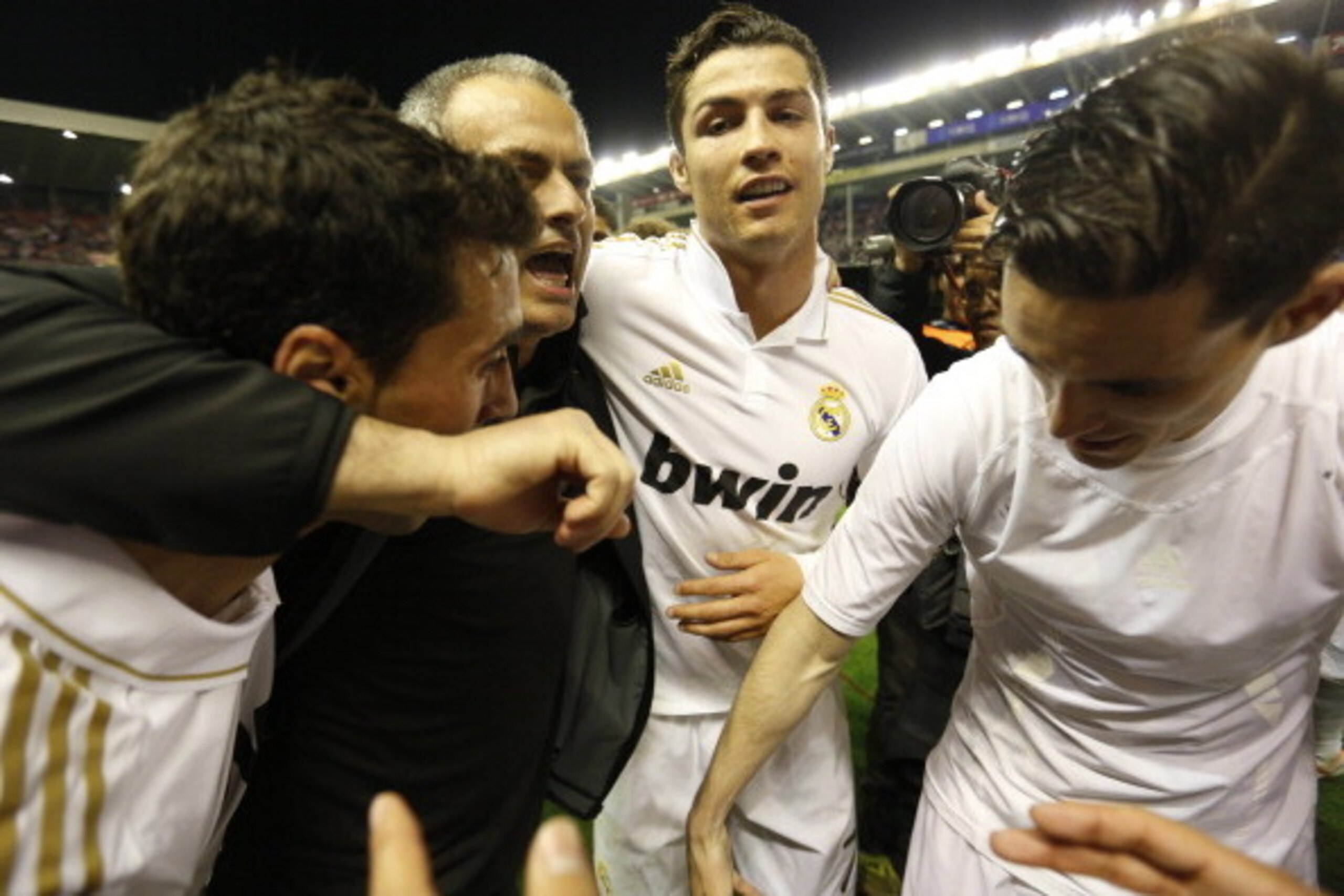 (FromL) Real Madrid's defender Alvaro Arbeloa, Real Madrid's Portuguese coach Jose Mourinho, Real Madrid's Portuguese forward Cristiano Ronaldo and Real Madrid's midfielder Jose Maria Callejon celebrate after winning the Spanish league football match Athl