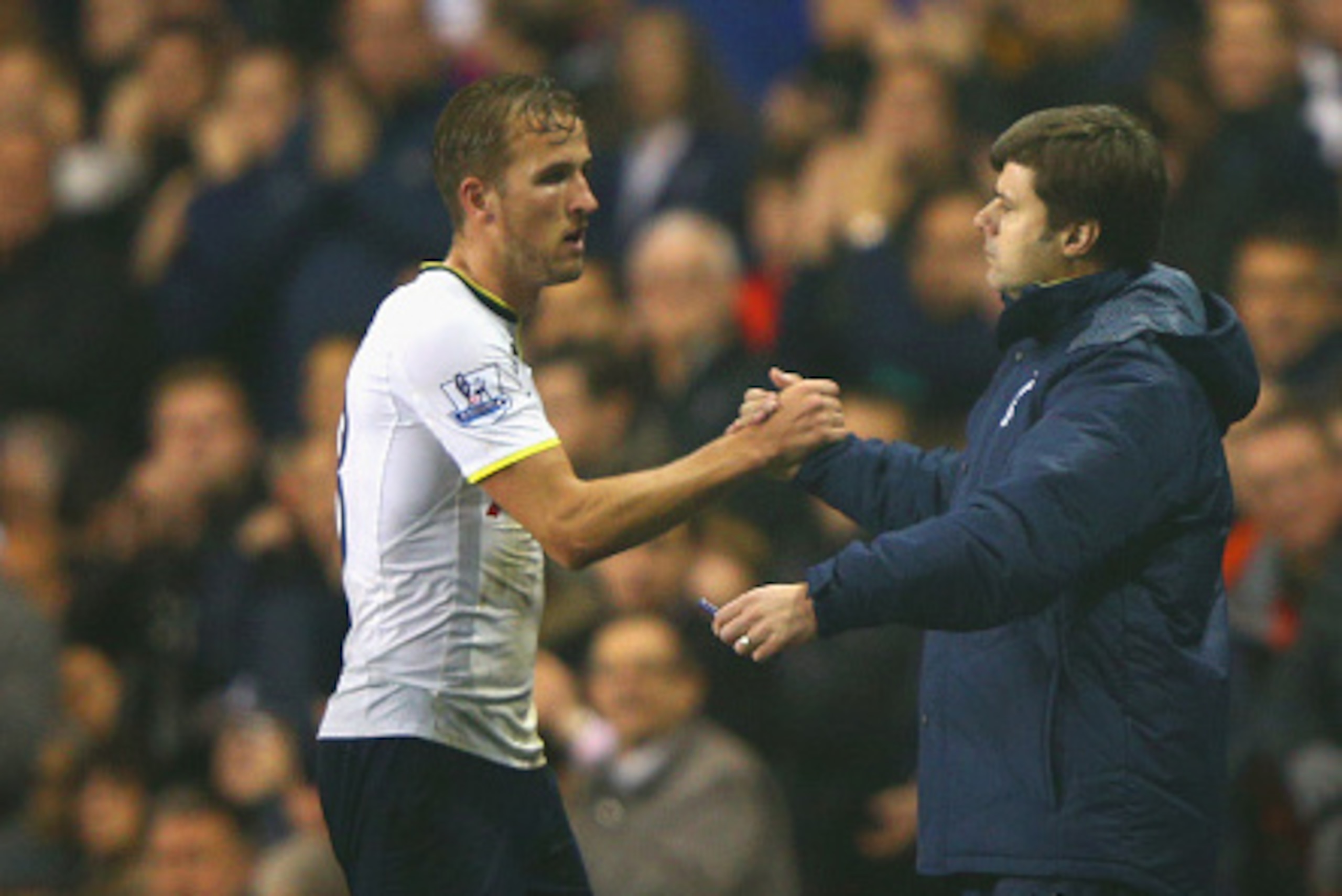 LONDON, ENGLAND - OCTOBER 29:  Harry Kane of Spurs shakes hands with Manager Mauricio Pochettino of Spurs during the Capital One Cup Fourth Round match Tottenham Hotspur and Brighton & Hove Albion at White Hart Lane on October 29, 2014 in London, England.