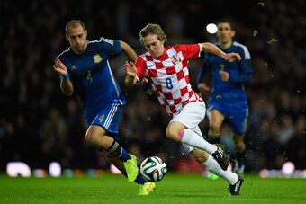 LONDON, ENGLAND - NOVEMBER 12:  Alen Halilovic of Croatia is challenged by Pablo Zabaleta of Argentina during an International Friendly between Argentina and Croatia at Boleyn Ground on November 12, 2014 in London, England.  (Photo by Mike Hewitt/Getty Im