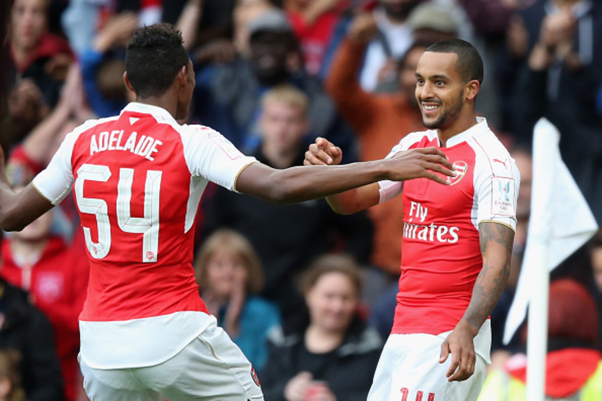 LONDON, ENGLAND - JULY 26:  Theo Walcott of Arsenal celebrates with team mate Jeff Reine-Adelaide during the Emirates Cup match between Arsenal and VfL Wolfsburg at the Emirates Stadium on July 26, 2015 in London, England.  (Photo by David Rogers/Getty Im