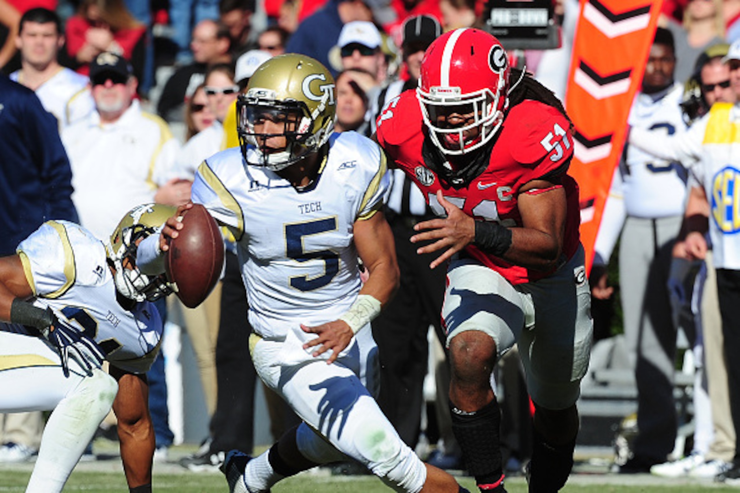 ATHENS, GA - NOVEMBER 29: Justin Thomas #5 of the Georgia Tech Yellow Jackets is pursued by Ramik Wilson #51 of the Georgia Bulldogs at Sanford Stadium on November 29, 2014 in Athens, Georgia. (Photo by Scott Cunningham/Getty Images) ATHENS, GA - NOVEMBER 29: Justin Thomas #5 of the Georgia Tech Yellow Jackets is pursued by Ramik Wilson #51 of the Georgia Bulldogs at Sanford Stadium on November 29, 2014 in Athens, Georgia. (Photo by Scott Cunningham/Getty Images)