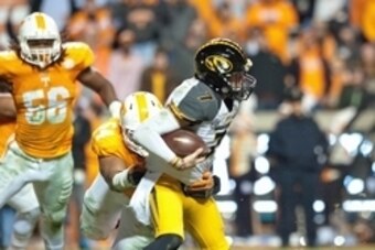 Nov 22, 2014; Knoxville, TN, USA; Missouri Tigers quarterback Maty Mauk (7) is sacked by Tennessee Volunteers defensive lineman Jordan Williams (54) during the first half at Neyland Stadium. Mandatory Credit: Jim Brown-USA TODAY Sports