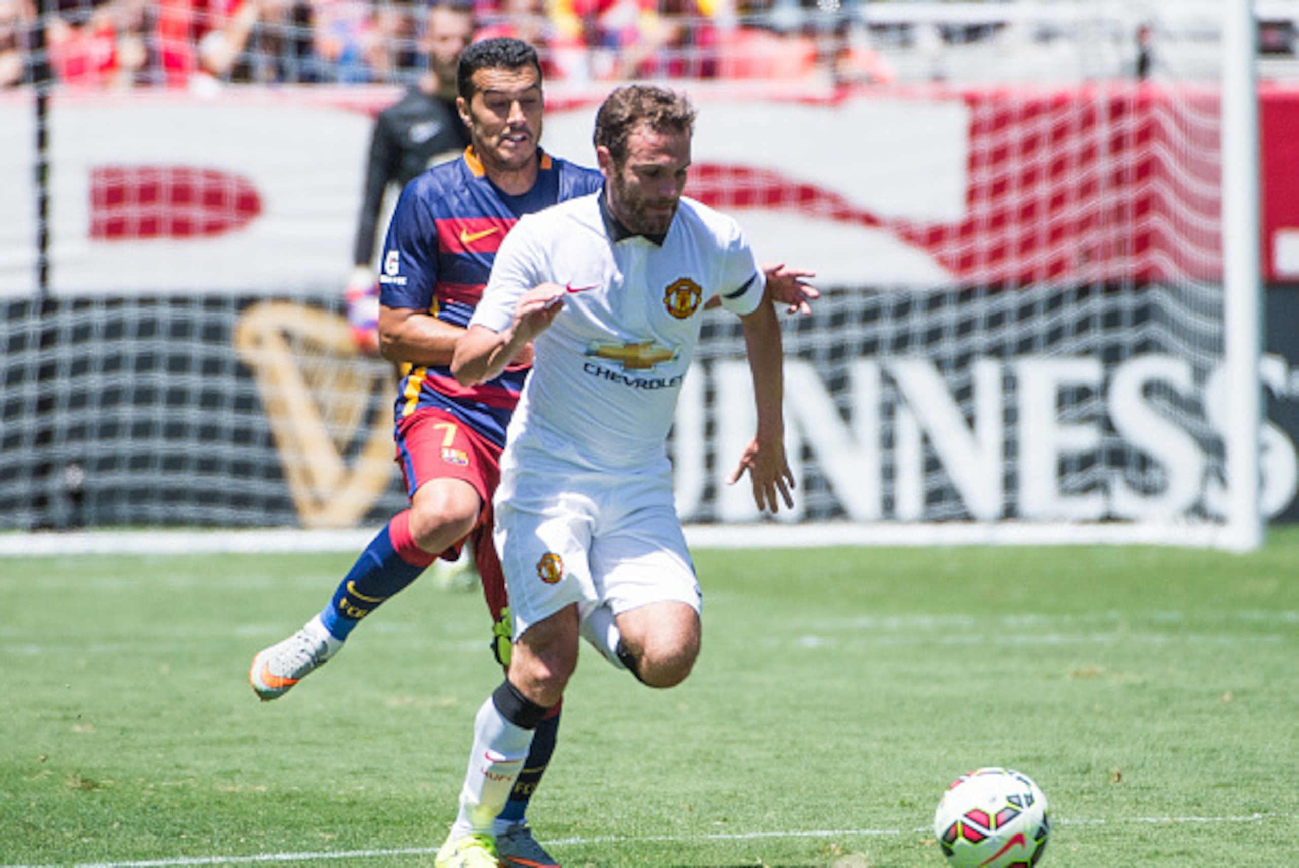 SANTA CLARA, CA - JULY 25: Juan Mata #8 of Manchester United races upfield as Pedro #7 of Barcelona chases during the International Champions Cup 2015 match between FC Barcelona and Manchester United at Levi's Stadium on July 25, 2015 in Santa Clara, Cali SANTA CLARA, CA - JULY 25: Juan Mata #8 of Manchester United races upfield as Pedro #7 of Barcelona chases during the International Champions Cup 2015 match between FC Barcelona and Manchester United at Levi's Stadium on July 25, 2015 in Santa Clara, Cali