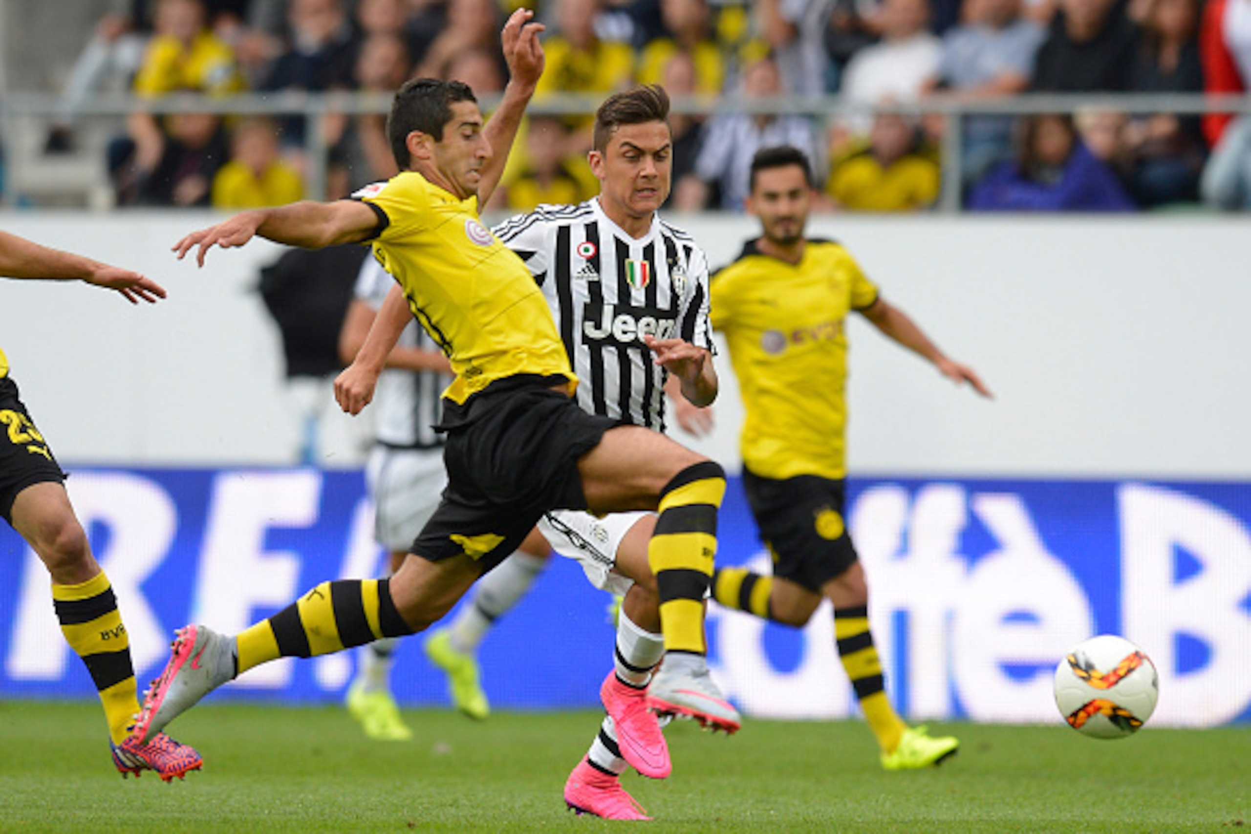 ST GALLEN, SWITZERLAND - JULY 25: Henrikh Mkhitaryan of Dortmund (L) is challenged by Paulo Dybala of Juventus during the friendly match between Juventus and Borussia Dortmund on July 25, 2015 in St Gallen, Switzerland. (Photo by Daniel Kopatsch/Getty Im ST GALLEN, SWITZERLAND - JULY 25: Henrikh Mkhitaryan of Dortmund (L) is challenged by Paulo Dybala of Juventus during the friendly match between Juventus and Borussia Dortmund on July 25, 2015 in St Gallen, Switzerland. (Photo by Daniel Kopatsch/Getty Im