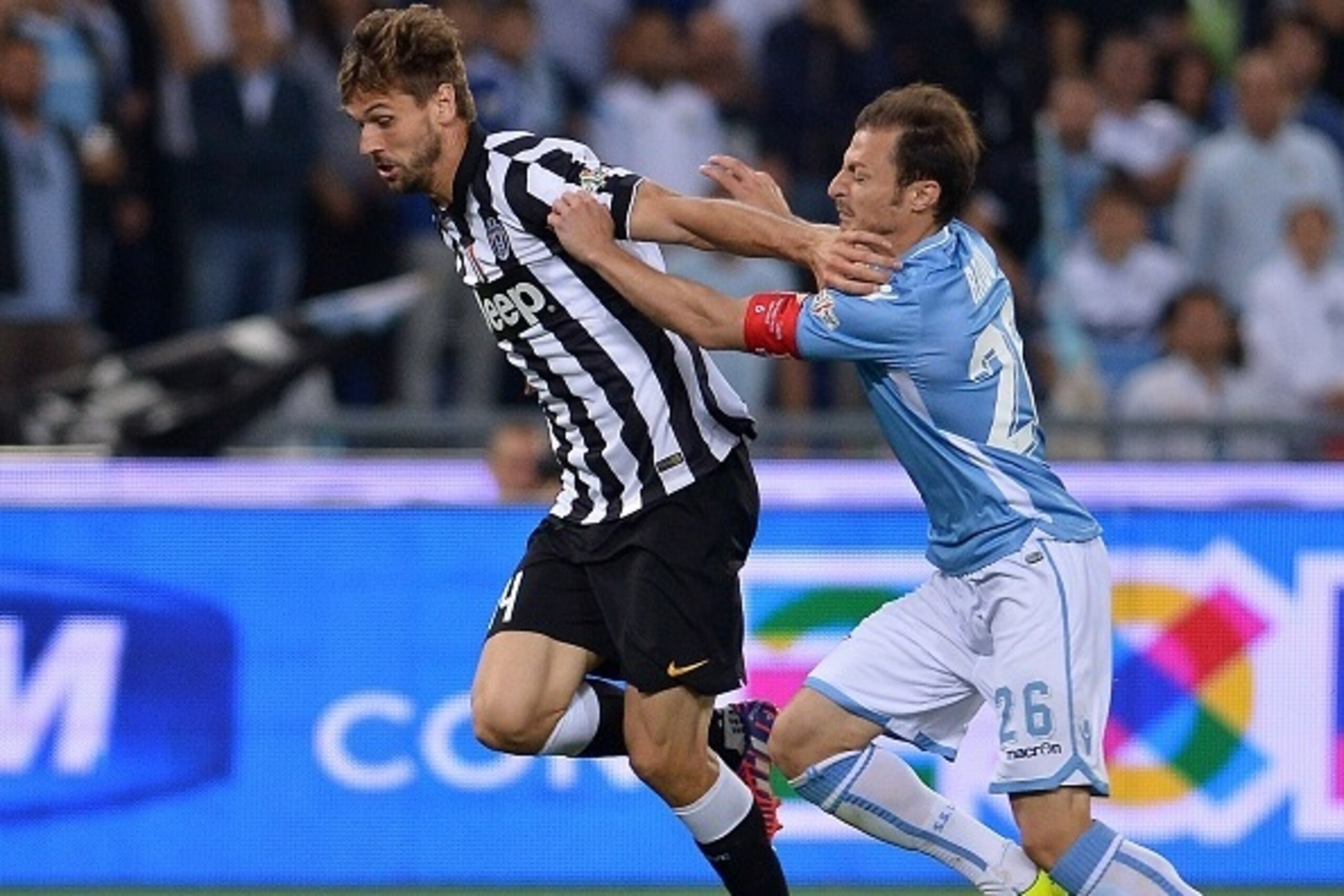 Juventus' forward from Spain Fernando Llorente (L) fights for the ball with Lazio's defender from Romania Stefan Radu during the Italian Tim Cup final match (Coppa Italia) between Juventus and Lazio on May 20, 2015 at the Stadio Olimpico in Rome. AFP P Juventus' forward from Spain Fernando Llorente (L) fights for the ball with Lazio's defender from Romania Stefan Radu during the Italian Tim Cup final match (Coppa Italia) between Juventus and Lazio on May 20, 2015 at the Stadio Olimpico in Rome. AFP P