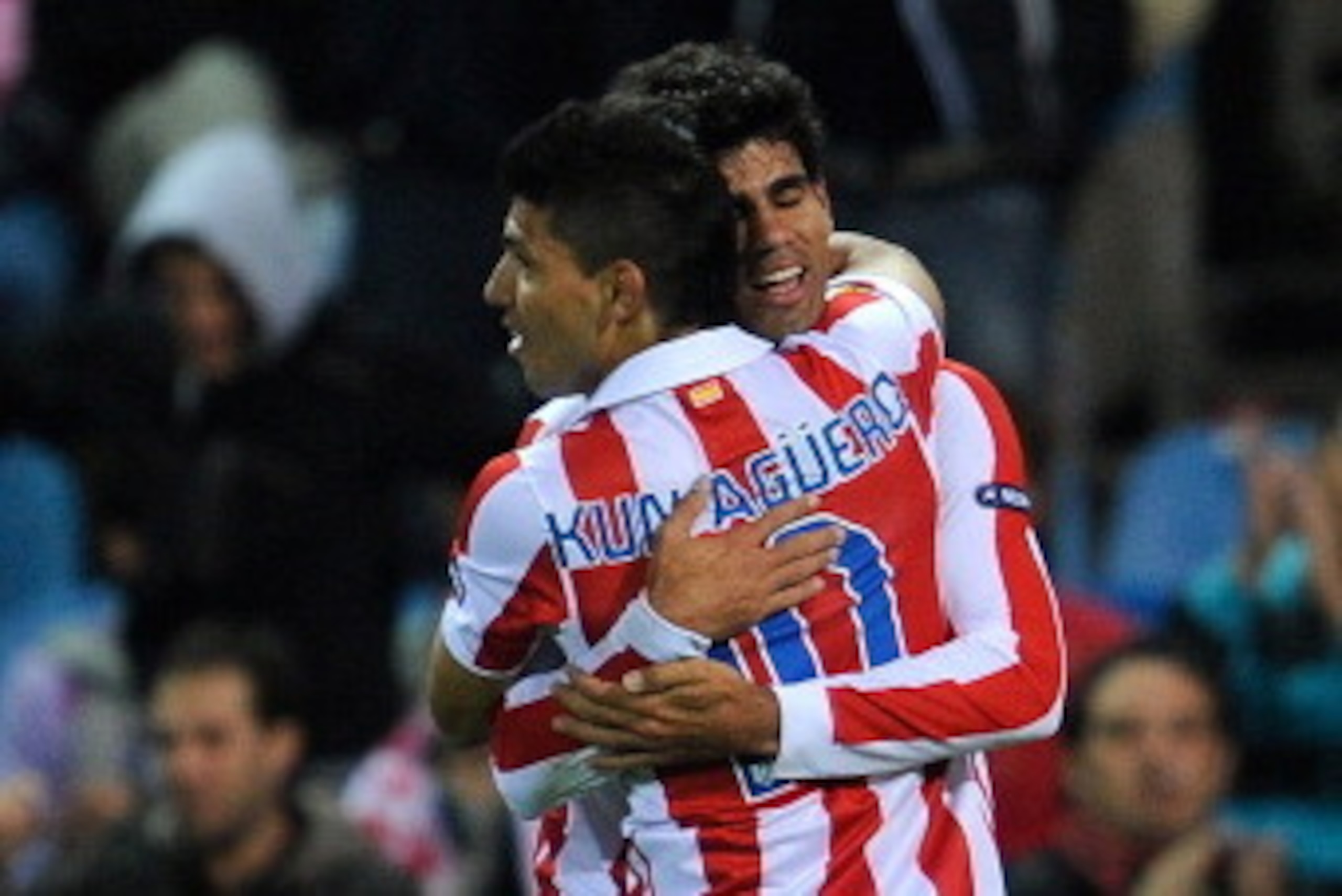 Atletico Madrid's  Diego Da Silva Costa (R) celebrates his goal against Rosenborg's BK with teammate Sergio Leonel Aguero during their UEFA Europa League football match at Vicente Calderon stadium in Madrid, on October 21, 2010.   AFP PHOTO/ DANI POZO (Ph