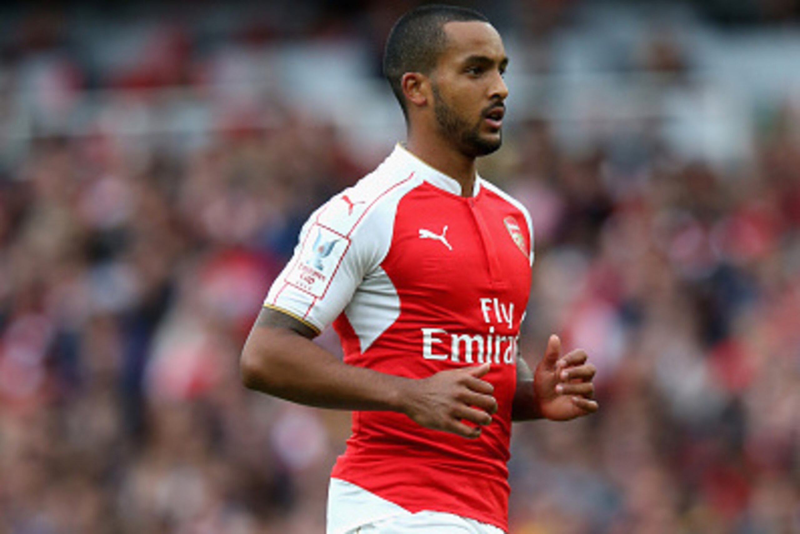 LONDON, ENGLAND - JULY 26: Theo Walcott of Arsenal looks on during the Emirates Cup match between Arsenal and VfL Wolfsburg at the Emirates Stadium on July 26, 2015 in London, England. (Photo by David Rogers/Getty Images) LONDON, ENGLAND - JULY 26: Theo Walcott of Arsenal looks on during the Emirates Cup match between Arsenal and VfL Wolfsburg at the Emirates Stadium on July 26, 2015 in London, England. (Photo by David Rogers/Getty Images)