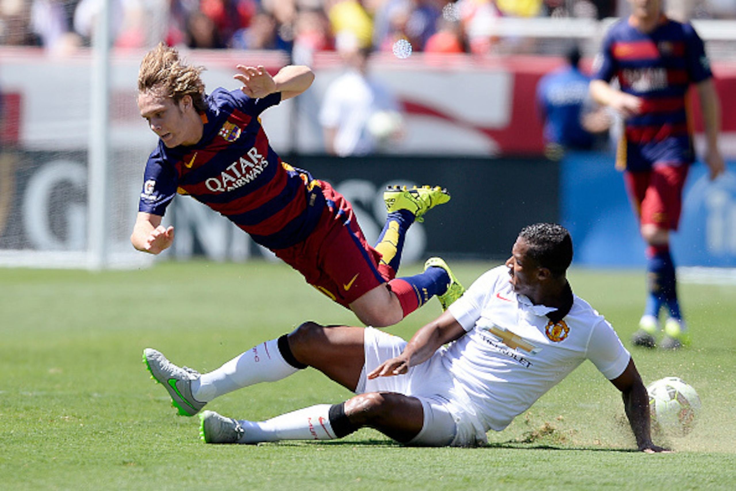 SANTA CLARA, CA - JULY 25: Alan Halilovic #30 of FC Barcelona gets airborne after a tackle by Antonio Valencia #25 of Manchester United during the second half of their International Champions Cup friendly soccer match at the Levi's Stadium July 25, 2015 i SANTA CLARA, CA - JULY 25: Alan Halilovic #30 of FC Barcelona gets airborne after a tackle by Antonio Valencia #25 of Manchester United during the second half of their International Champions Cup friendly soccer match at the Levi's Stadium July 25, 2015 i