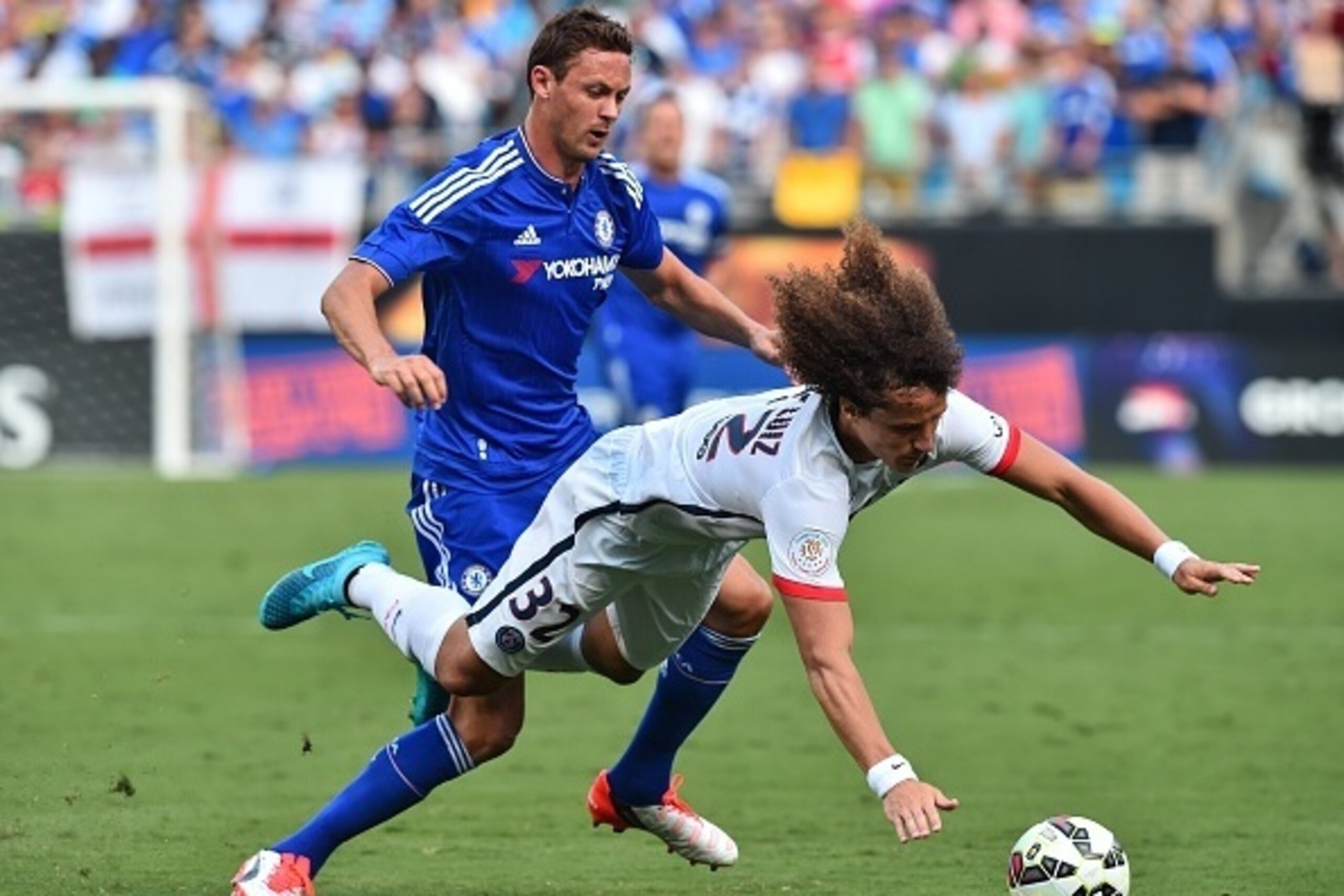 Paris Saint-Germain's David Luiz (R) is fouled by Chelsea's Nemanja Matic during an International Champions Cup football match in Charlotte, North Carolina, on July 25, 2015.    AFP PHOTO/NICHOLAS KAMM        (Photo credit should read NICHOLAS KAMM/AFP/Ge