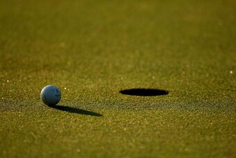PONTE VEDRA BEACH, FL - MAY 05:  A golf ball sits near the hole during a practice round prior to the start of THE PLAYERS on the Stadium Course at TPC Sawgrass on May 5, 2009 in Ponte Vedra Beach, Florida.  (Photo by Richard Heathcote/Getty Images)