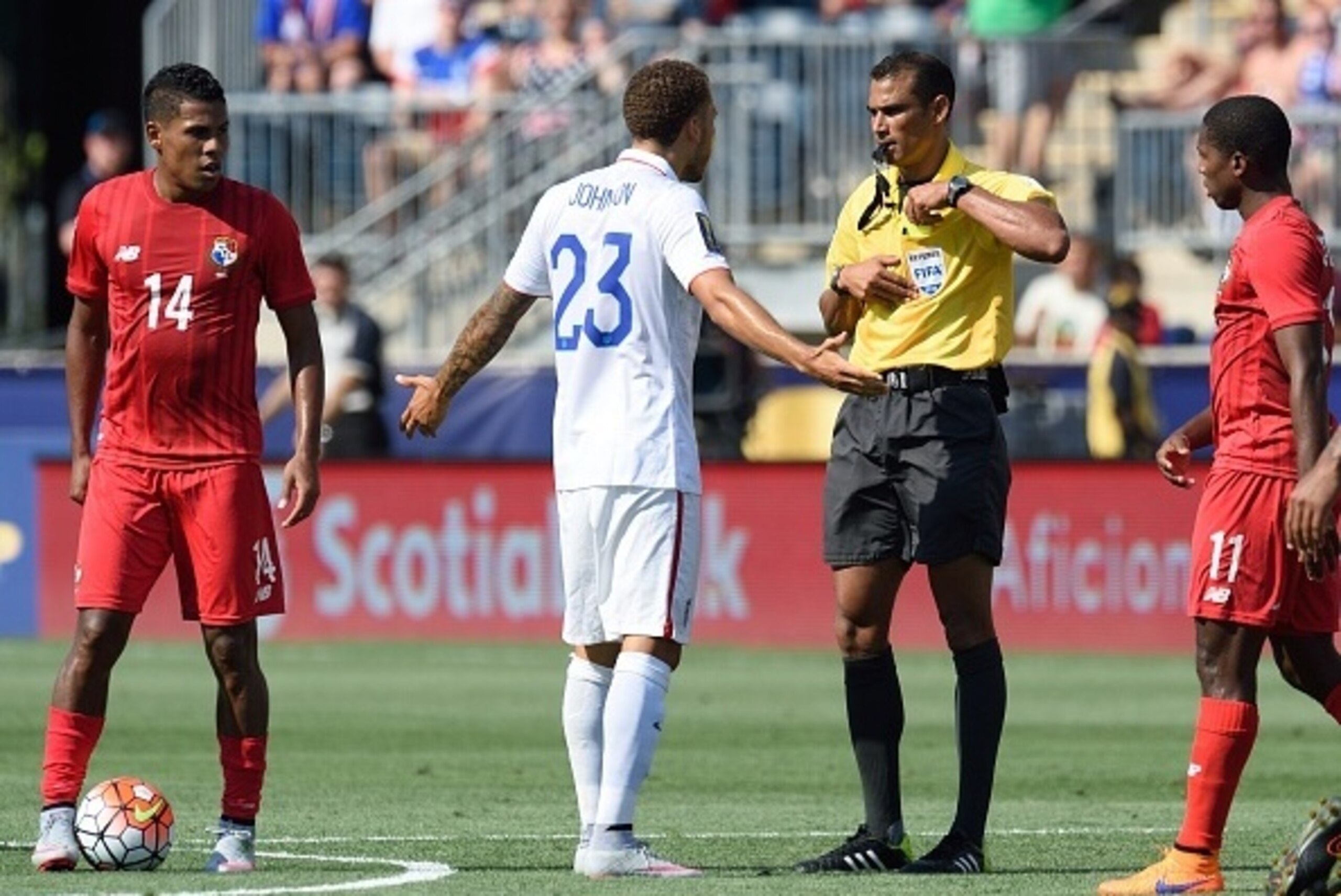 US player Fabian Johnson (23) is given a yellow card during the 2015 CONCACAF Gold Cup third place match between the USA and Panama July 25, 2015 in Chester, Pennsylvania.  Reserve goalkeeper Luis Mejia denied the last three US shooters and suspension-wea