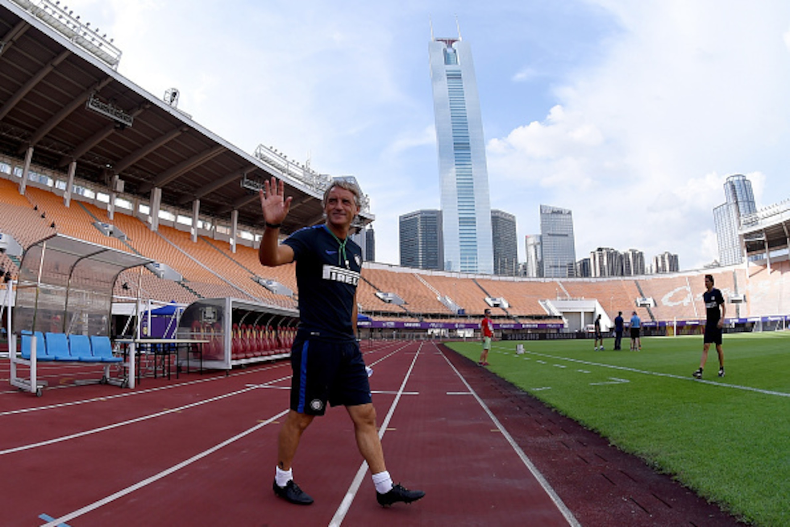 GUANGZHOU, CHINA - JULY 26: Head coach Roberto Mancini waves to fans before the FC Internazionale Training Camp at Tianhe Stadium on July 26, 2015 in Guangzhou, China. (Photo by Claudio Villa - Inter/Getty Images) GUANGZHOU, CHINA - JULY 26: Head coach Roberto Mancini waves to fans before the FC Internazionale Training Camp at Tianhe Stadium on July 26, 2015 in Guangzhou, China. (Photo by Claudio Villa - Inter/Getty Images)