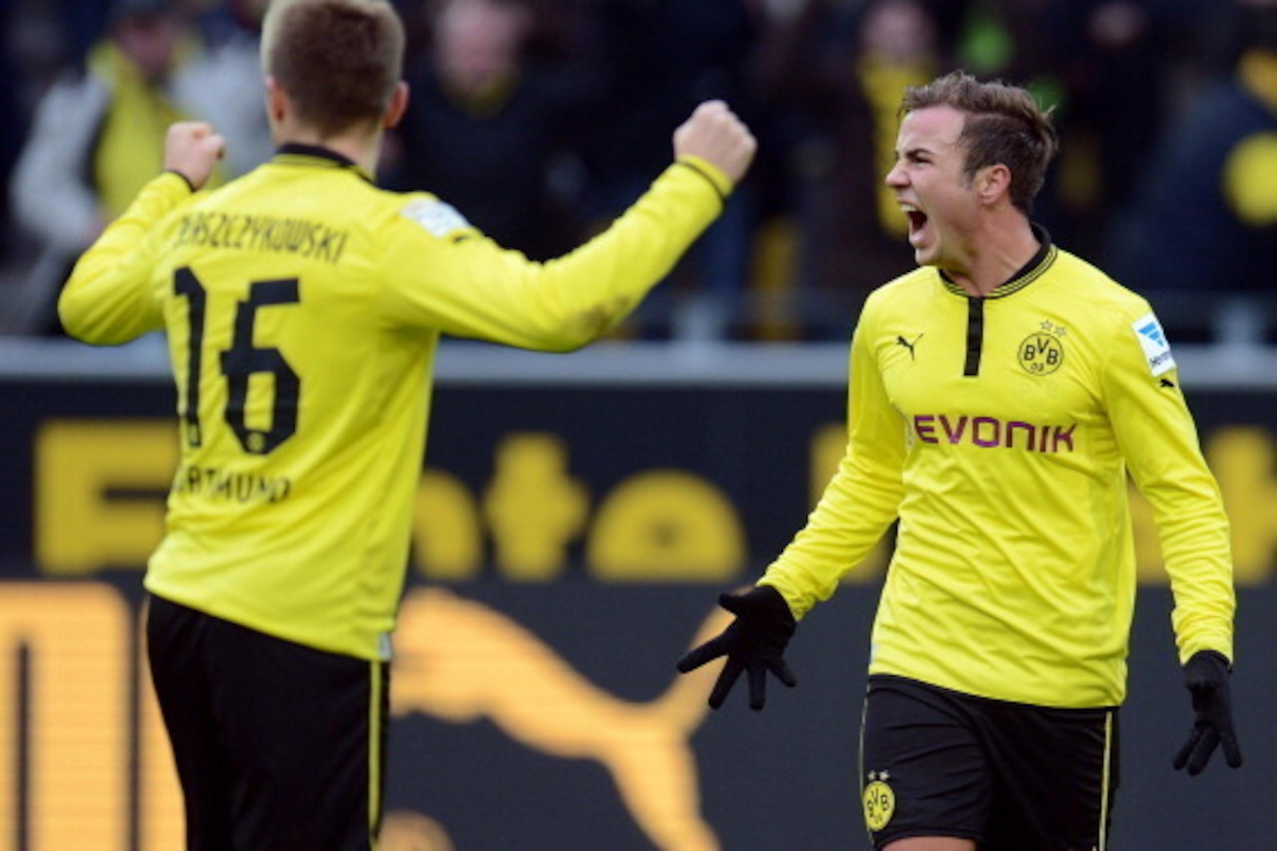 Dortmund's midfielder Mario Goetze (R) reacts during the German first division Bundesliga football match Borussia Dortmund vs Hamburger SV in the German city of Dortmund on February 9, 2013. Hamburg won 1-4. AFP PHOTO / PATRIK STOLLARZ
RESTRICTIONS / EMB Dortmund's midfielder Mario Goetze (R) reacts during the German first division Bundesliga football match Borussia Dortmund vs Hamburger SV in the German city of Dortmund on February 9, 2013. Hamburg won 1-4. AFP PHOTO / PATRIK STOLLARZ
RESTRICTIONS / EMB