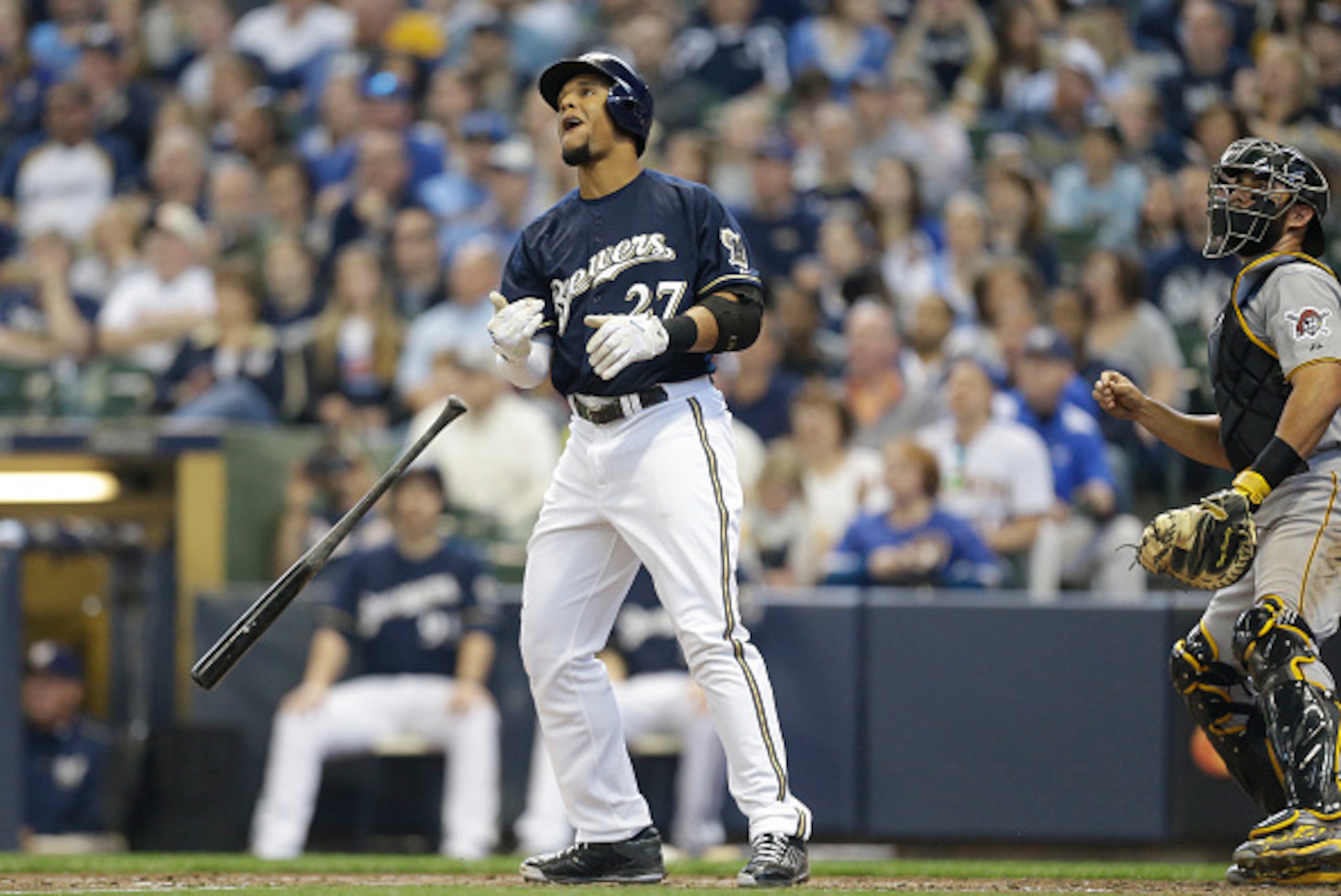 MILWAUKEE, WI - APRIL 12: Carlos Gomez #27 of the Milwaukee Brewers watches his two run home run in the third inning against the Pittsburgh Pirates at Miller Park on April 12, 2015 in Milwaukee, Wisconsin.  (Photo by Jeffrey Phelps/Getty Images)
