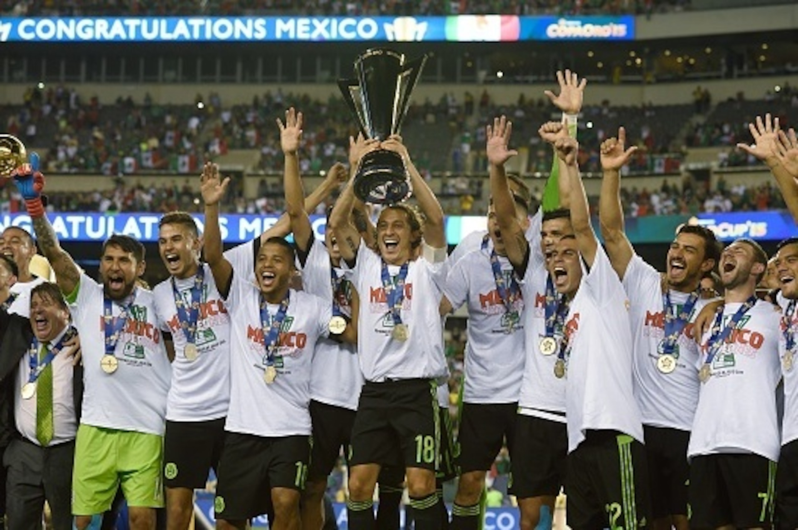 Mexico's national soccer team celebrates their victory in the 2015 CONCACAF Gold Cup final between Jamaica and Mexico July 26, 2015 in Philadelphia, Pennsylvania. AFP PHOTO/DON EMMERT (Photo credit should read DON EMMERT/AFP/Getty Images) Mexico's national soccer team celebrates their victory in the 2015 CONCACAF Gold Cup final between Jamaica and Mexico July 26, 2015 in Philadelphia, Pennsylvania. AFP PHOTO/DON EMMERT (Photo credit should read DON EMMERT/AFP/Getty Images)