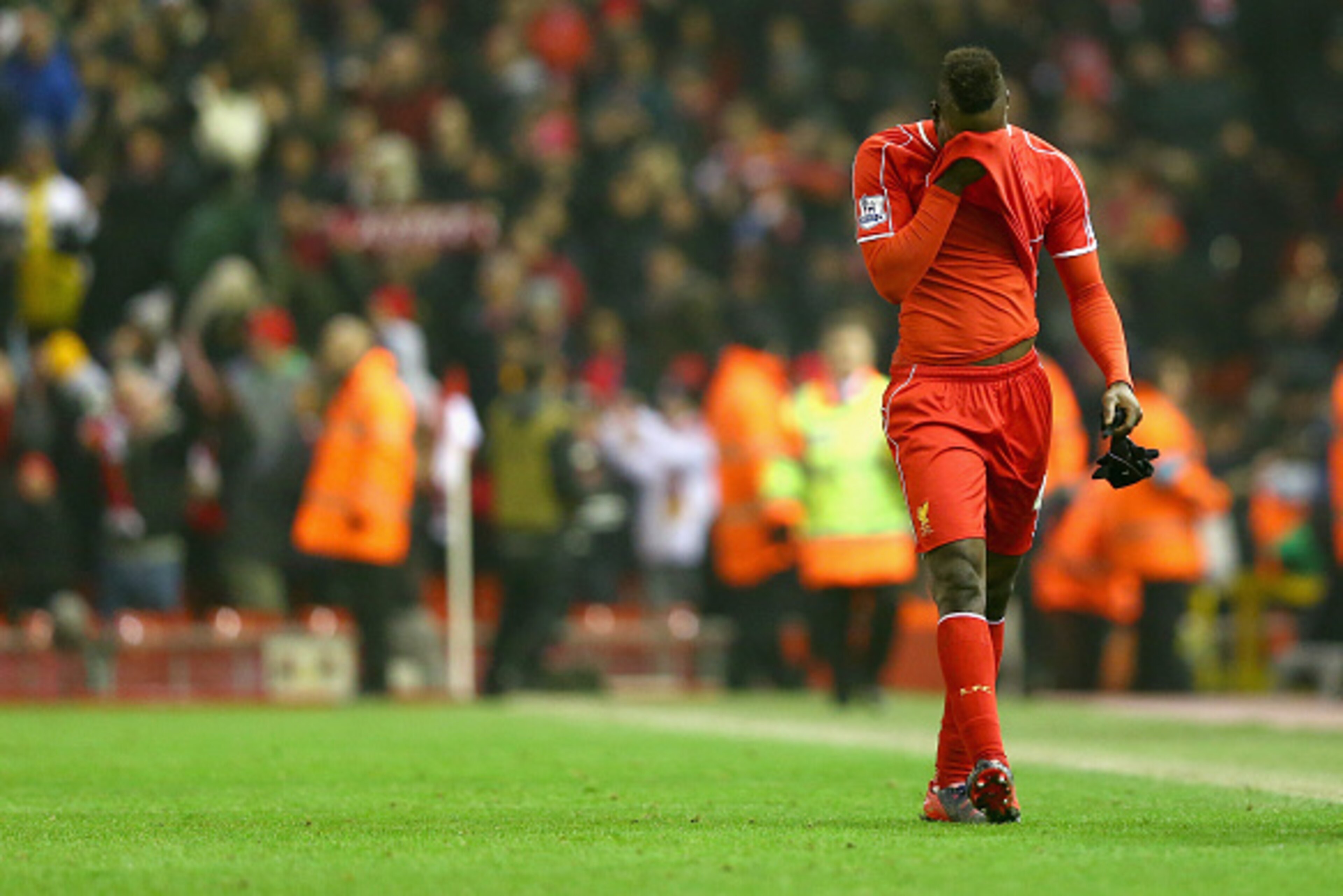 LIVERPOOL, ENGLAND - FEBRUARY 10:  Mario Balotelli of Liverpool walks off the pitch after scoring his second half winning goal during the Barclays Premier League match between Liverpool and Tottenham Hotspur at Anfield on February 10, 2015 in Liverpool, E