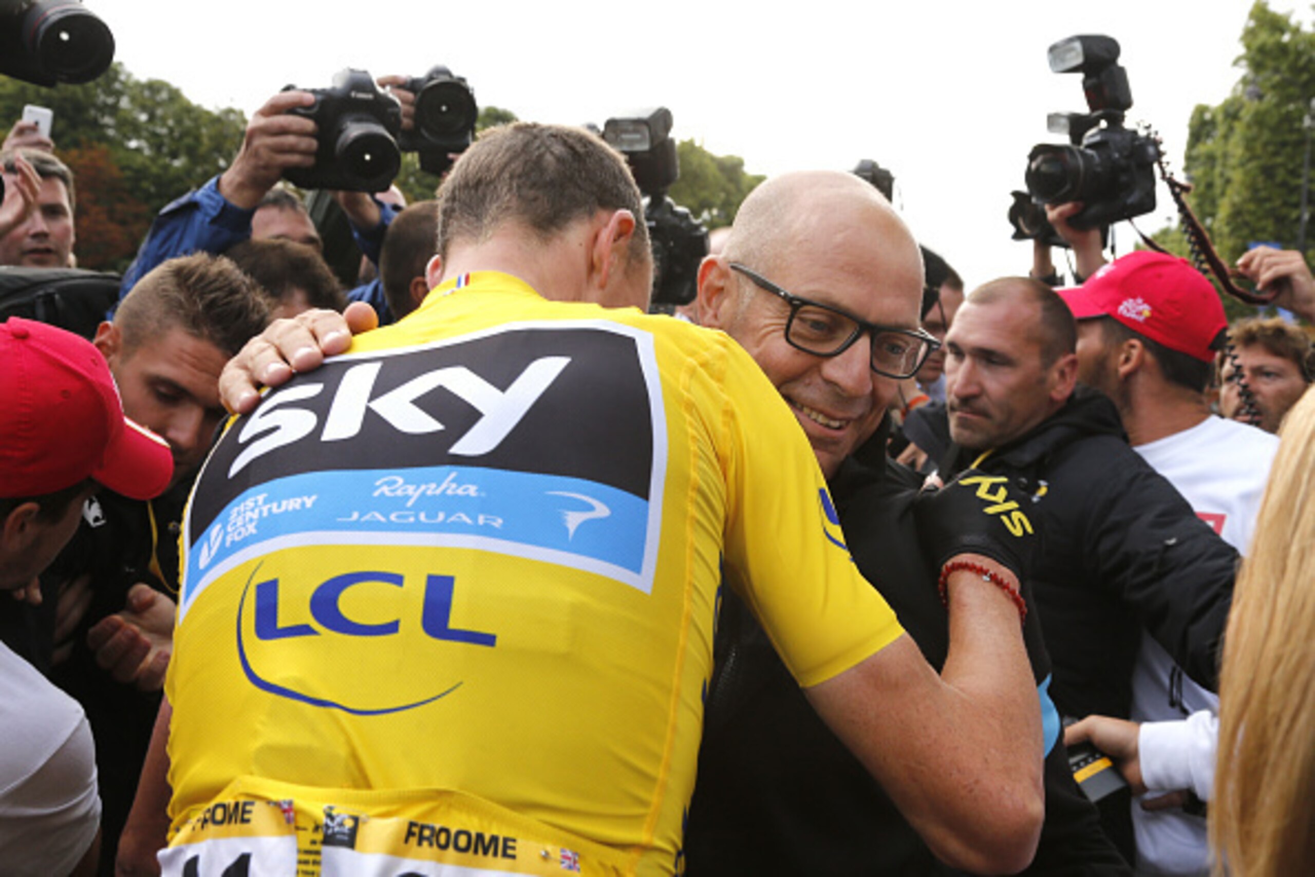 PARIS, FRANCE - JULY 26: Manager of Team Sky Dave Brailsford congratulates Chris Froome of Great Britain and Team Sky for his 2015 Tour de France victory, following stage twenty one of the 2015 Tour de France, a 109.5 km stage from Sevres to the Champs E PARIS, FRANCE - JULY 26: Manager of Team Sky Dave Brailsford congratulates Chris Froome of Great Britain and Team Sky for his 2015 Tour de France victory, following stage twenty one of the 2015 Tour de France, a 109.5 km stage from Sevres to the Champs E