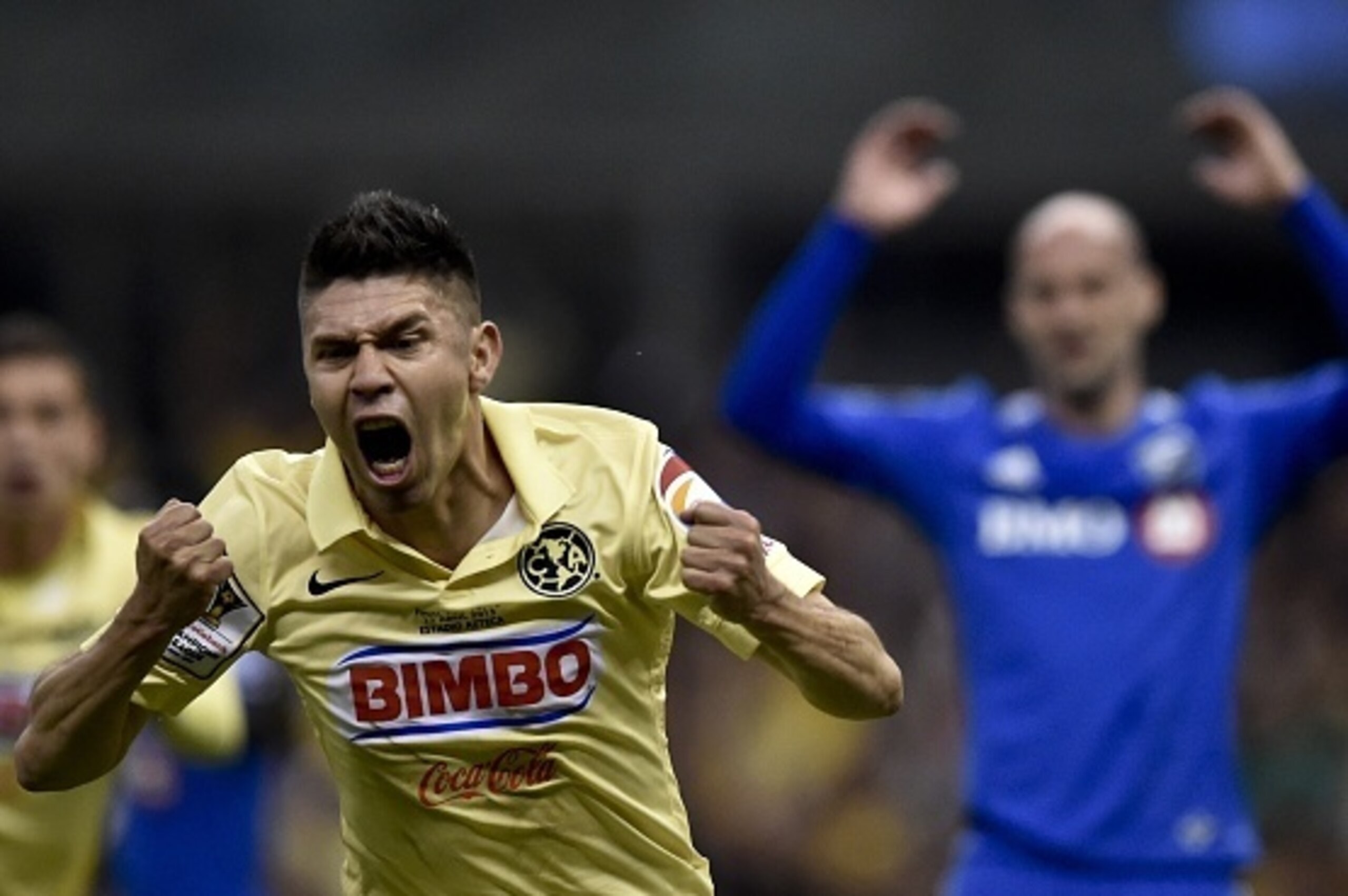 America's forward Oribe Peralta (L) celebrates after scoring against Impact of Montreal during their CONCACAF Champions League first leg final football match at the Azteca stadium in Mexico City on April 22, 2015. AFP PHOTO/ Yuri CORTEZ (Photo cred America's forward Oribe Peralta (L) celebrates after scoring against Impact of Montreal during their CONCACAF Champions League first leg final football match at the Azteca stadium in Mexico City on April 22, 2015. AFP PHOTO/ Yuri CORTEZ (Photo cred