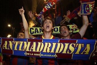 FC Barcelona supporters celebrate their team's victory near Canaletas fountain on the Ramblas after the Spanish Copa del Rey (King's Cup) final football match Athletic Club Bilbao vs FC Barcelona in Barcelona on May 30, 2015. Barcelona won 3-1.  AFP PHOTO