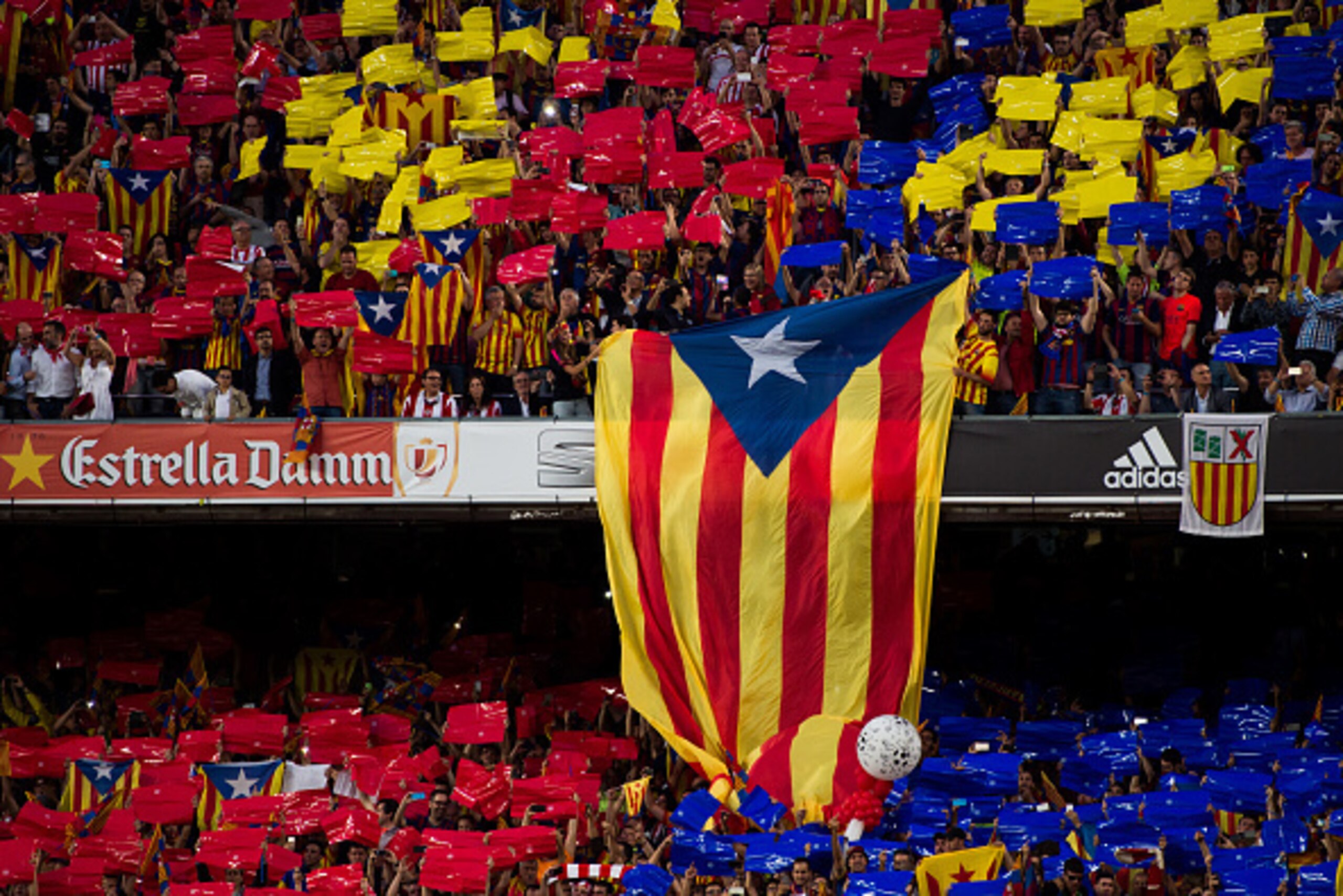 BARCELONA, SPAIN - MAY 30: A pro-independence of Catalonia flag is shown by supporters of FC Barcelona as Spanish National Anthem is played before the Copa del Rey Final between Athletic Club and FC Barcelona at Camp Nou on May 30, 2015 in Barcelona, Spai