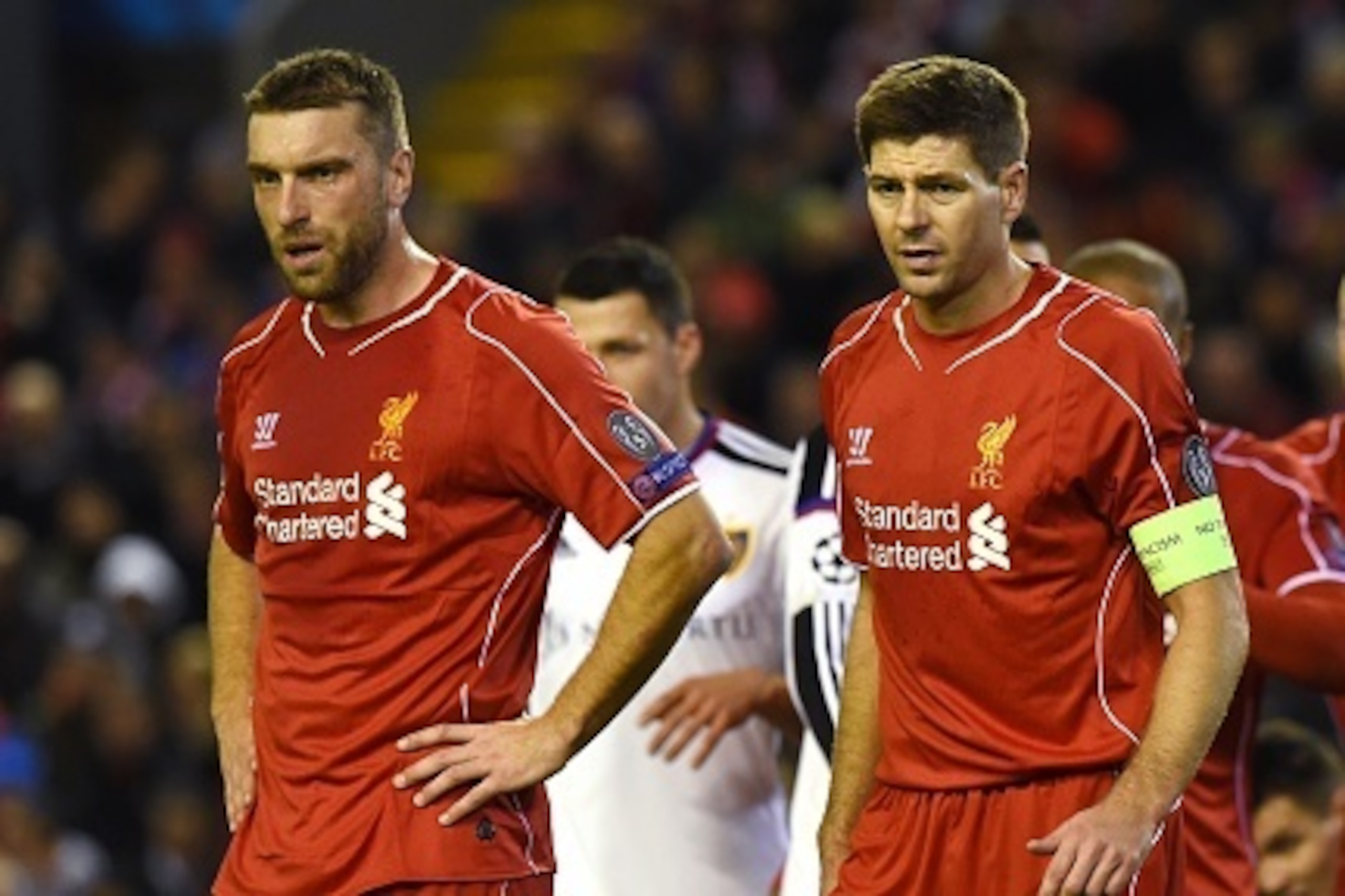 Liverpool's English striker Rickie Lambert (L) and Liverpool's English midfielder Steven Gerrard (C) line up to defend a corner during the UEFA Champions League group B football match between Liverpool and Basel at Anfield in Liverpool, north west England