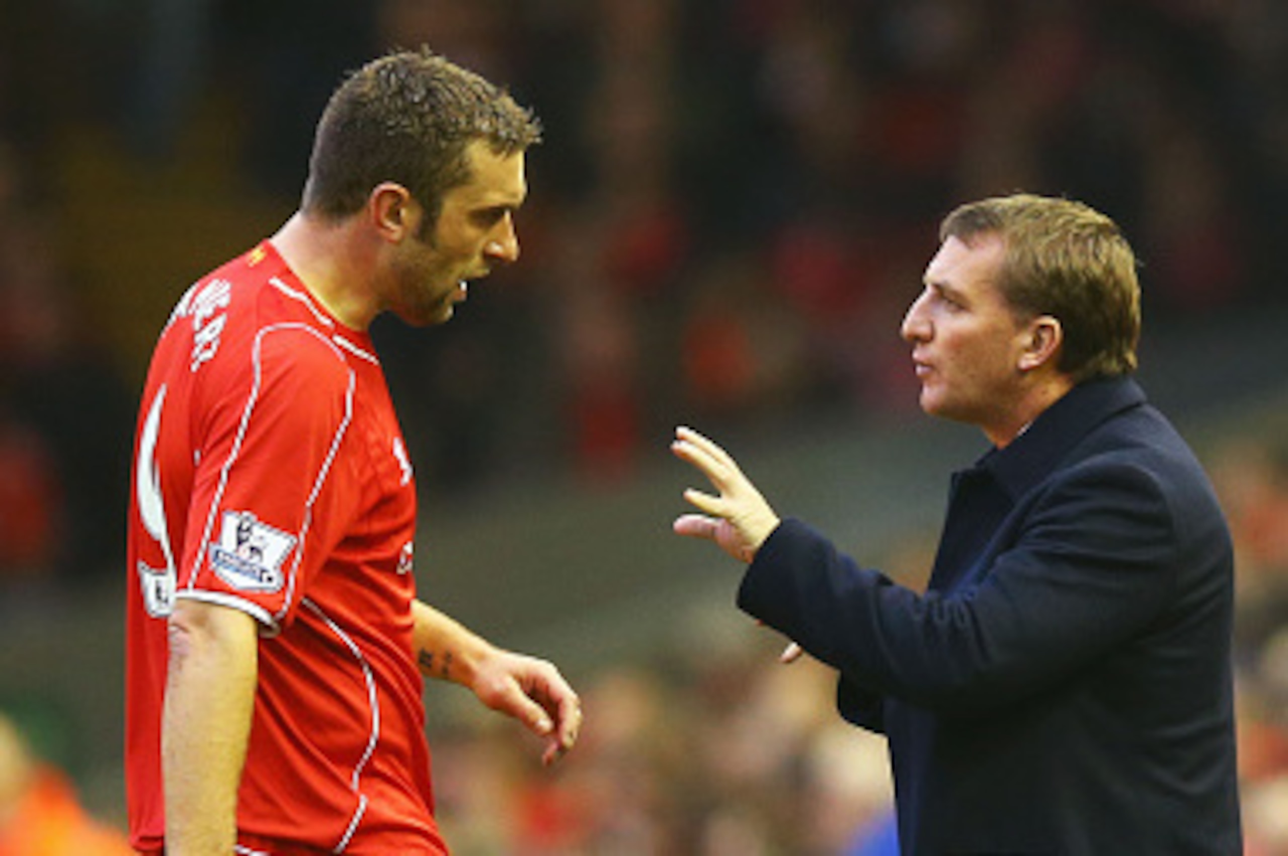 LIVERPOOL, ENGLAND - NOVEMBER 29:  Brendan Rodgers manager of Liverpool talks to Rickie Lambert of Liverpool during the Barclays Premier League match between Liverpool and Stoke City at Anfield on November 29, 2014 in Liverpool, England.  (Photo by Richar