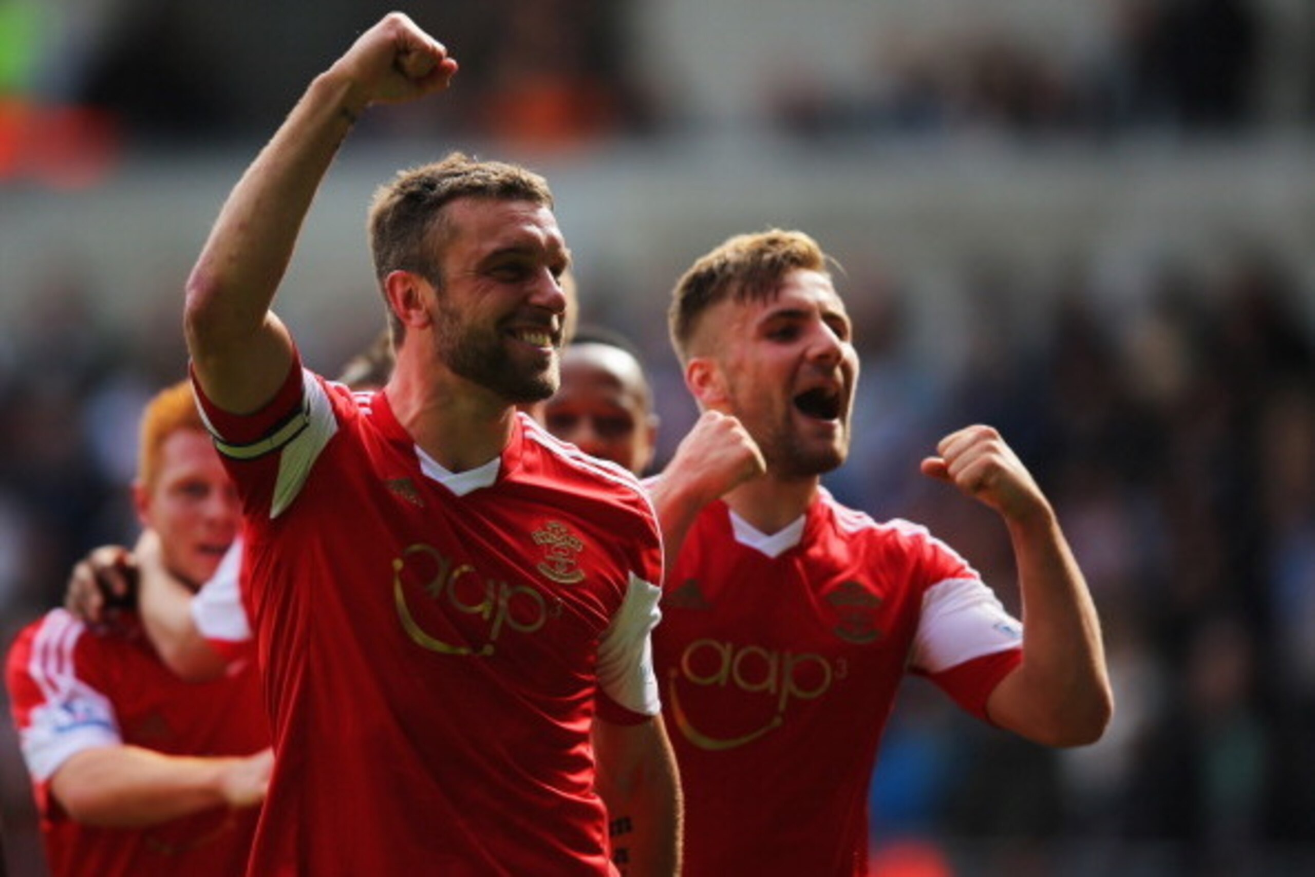 SWANSEA, WALES - MAY 03:  Rickie Lambert of Southampton celebrates with Luke Shaw (R) as he scores their first goal during the Barclays Premier League match between Swansea City and Southampton at Liberty Stadium on May 3, 2014 in Swansea, Wales.  (Photo 