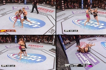 Rousey swaps punches with Tate and then rears back and lunges forward with a right hand. From there, she grabs ahold of Tate and works for the takedown.