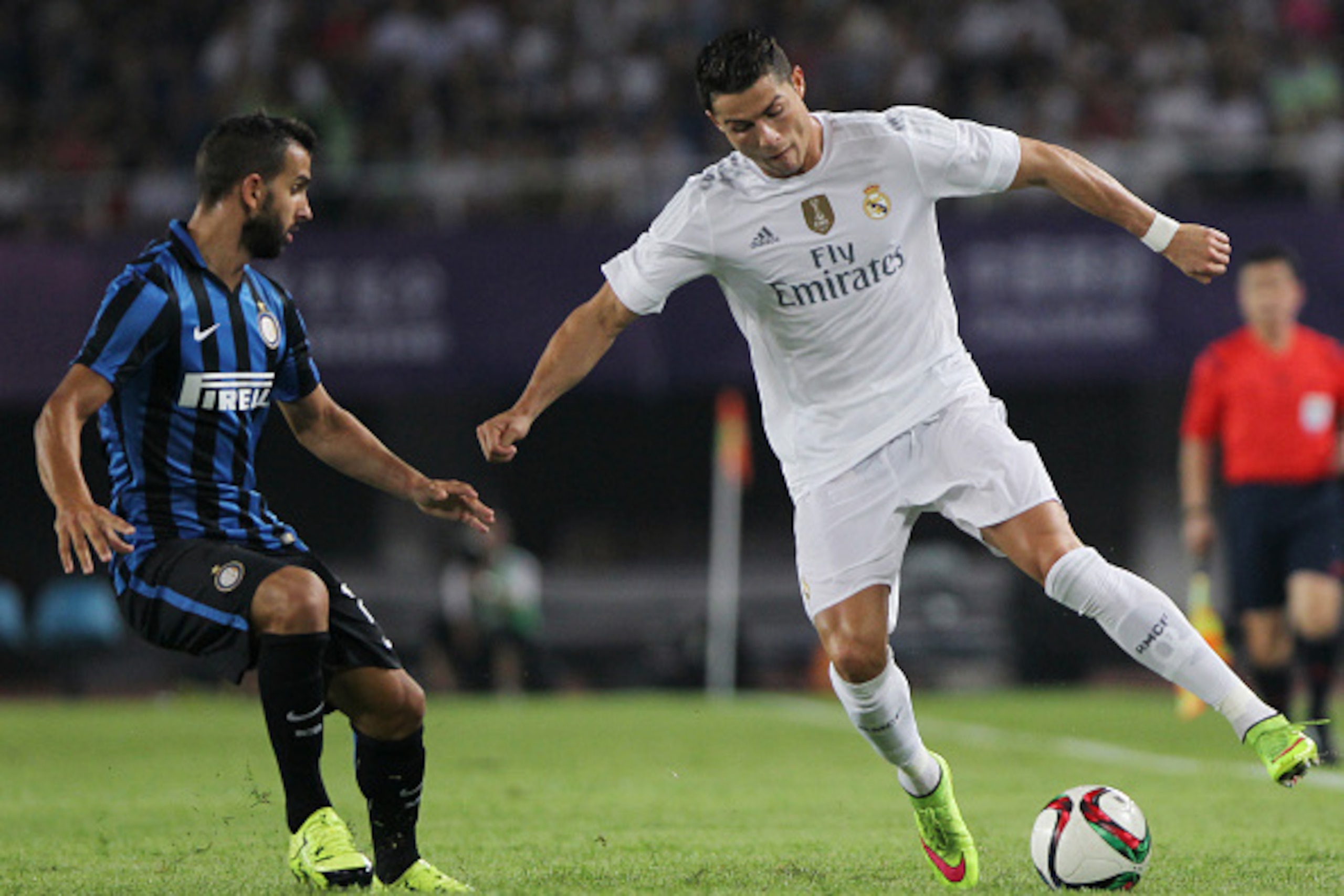 GUANGZHOU, CHINA - JULY 27: Cristiano Ronaldo of Real Madrid in action against Montyoya Torralbo Martin of FC Internazionale during the match of International Champions Cup China 2015 between Real Madrid and FC Internazionale at Tianhe Stadium on July 27,