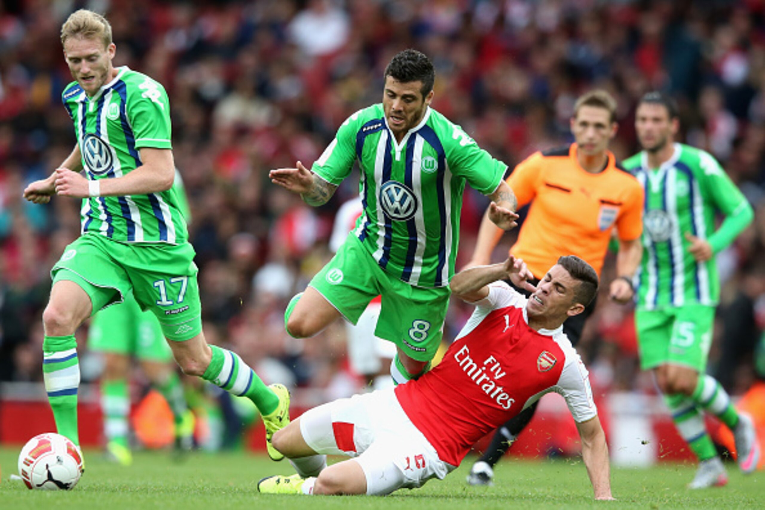 LONDON, ENGLAND - JULY 26:  Vieirnha of Wolfsburg is tackled by Gabriel during the Emirates Cup match between Arsenal and VfL Wolfsburg at the Emirates Stadium on July 26, 2015 in London, England.  (Photo by David Rogers/Getty Images)