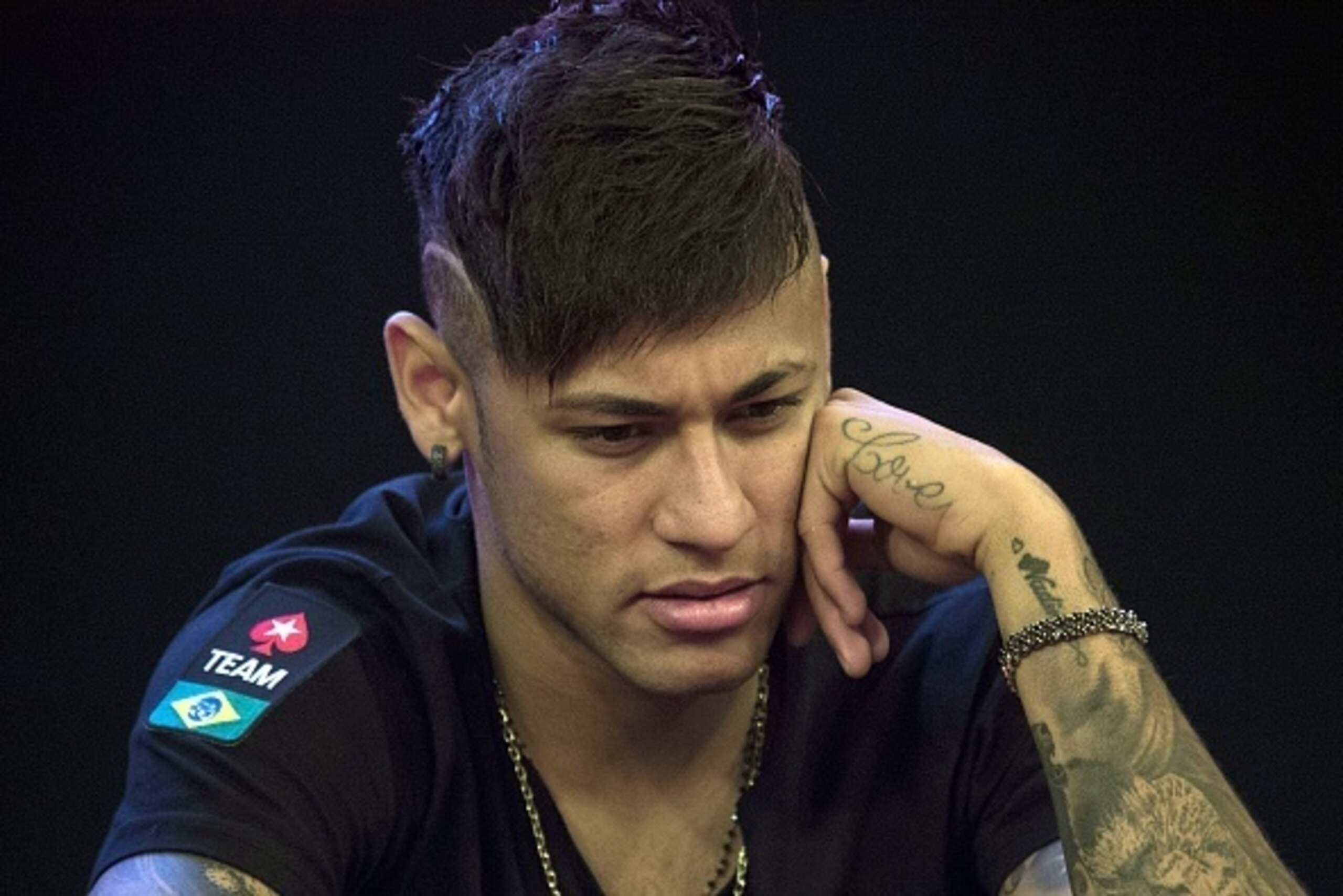 Brazilian football star and Barcelona player Neymar gestures during the Charity Home Game poker tournament in Sao Paulo, Brazil, on July 26, 2015. AFP PHOTO / Nelson ALMEIDA        (Photo credit should read NELSON ALMEIDA/AFP/Getty Images)