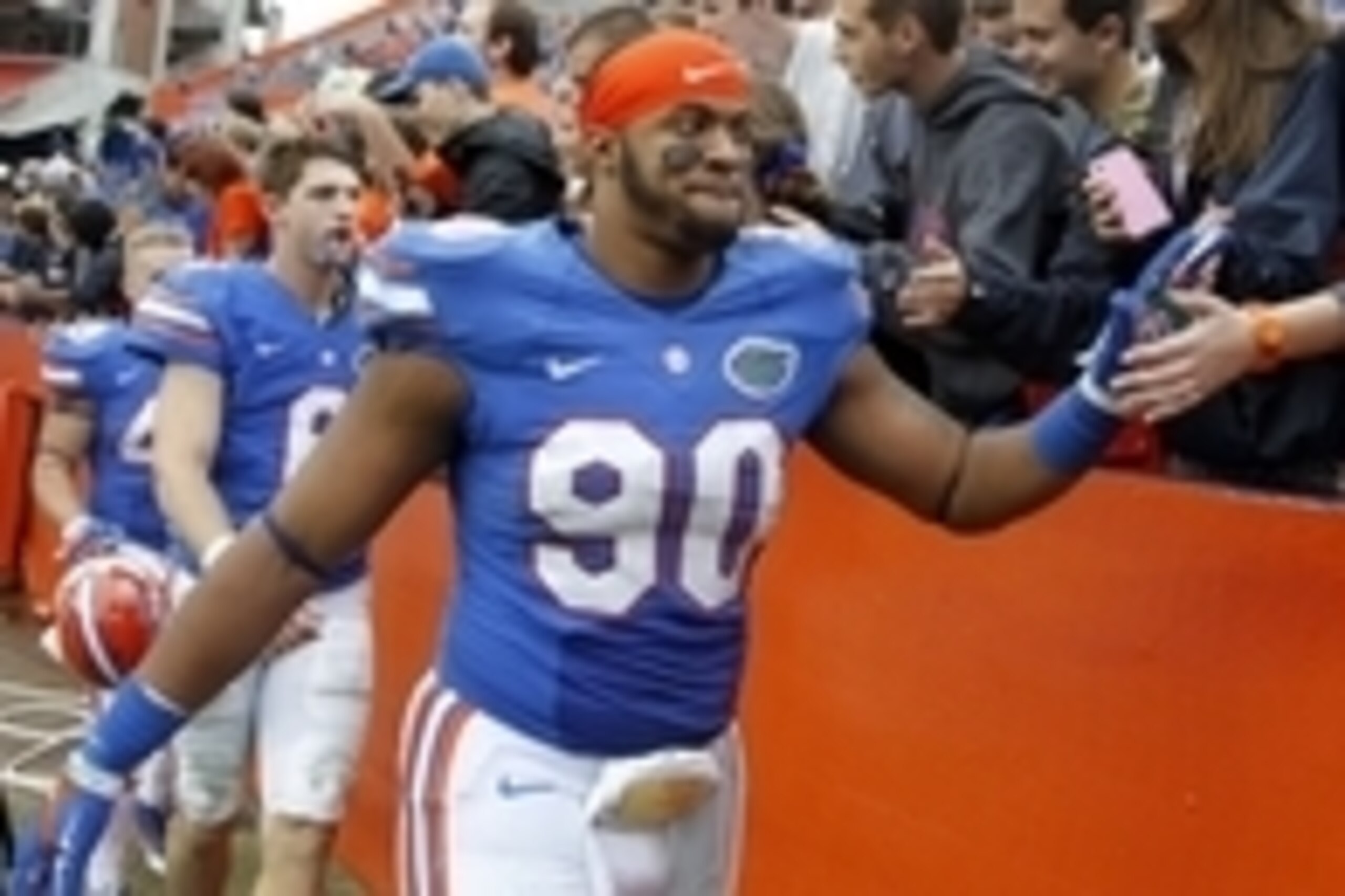 Nov 22, 2014; Gainesville, FL, USA; Florida Gators defensive lineman Jonathan Bullard (90) and quarterback Jeff Driskel (6) high five fans after they beat the Eastern Kentucky Colonels at Ben Hill Griffin Stadium. Florida Gators defeated the Eastern Kentu