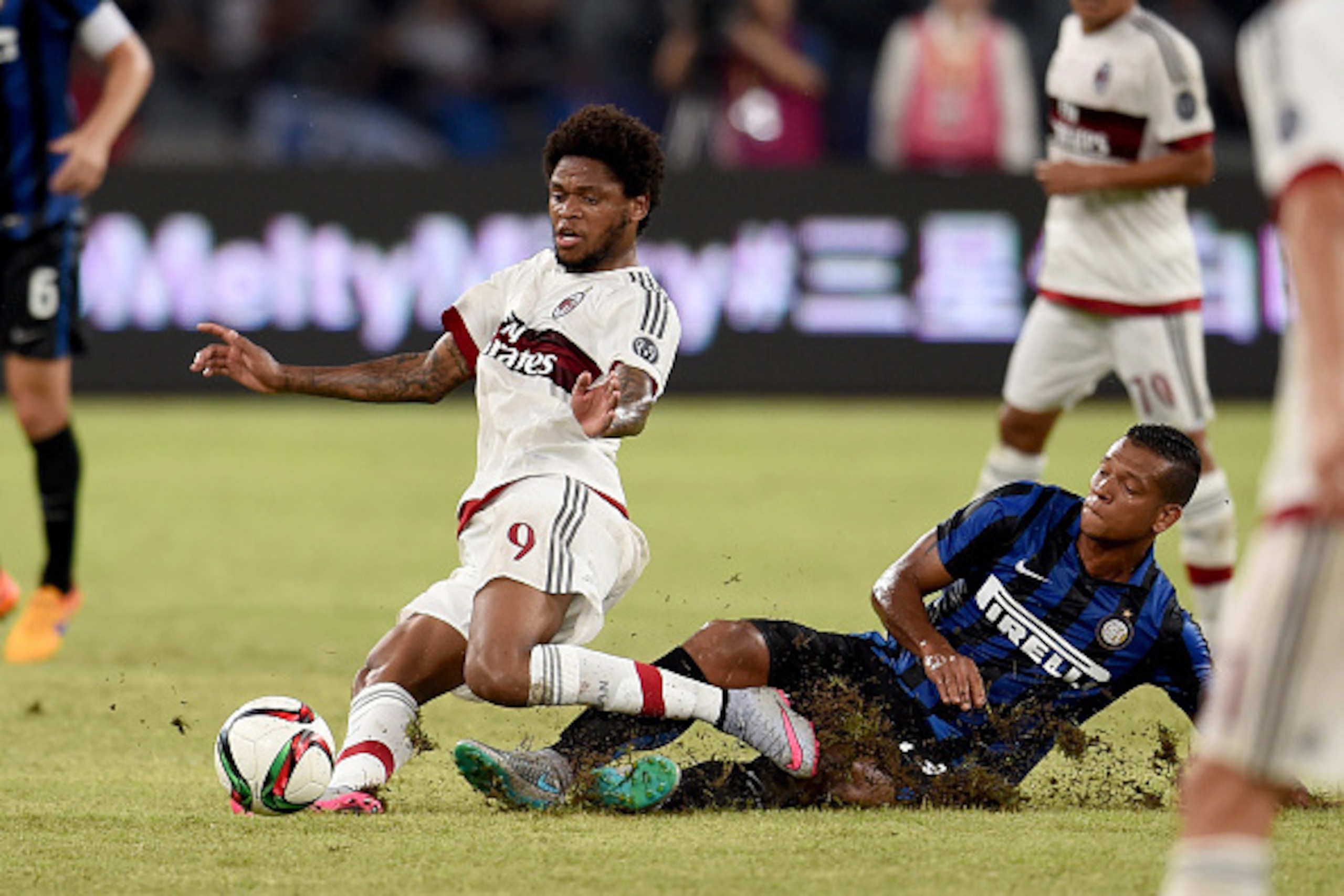 SHENZHEN, CHINA - JULY 25:  Fredy Guarin of FC Internazionale and  Luiz Adriano of AC Milan (L) compete for the ball during the International Champions Cup match between AC Milan and FC Internazionale  on July 25, 2015 in Shenzhen, China.  (Photo by Claud