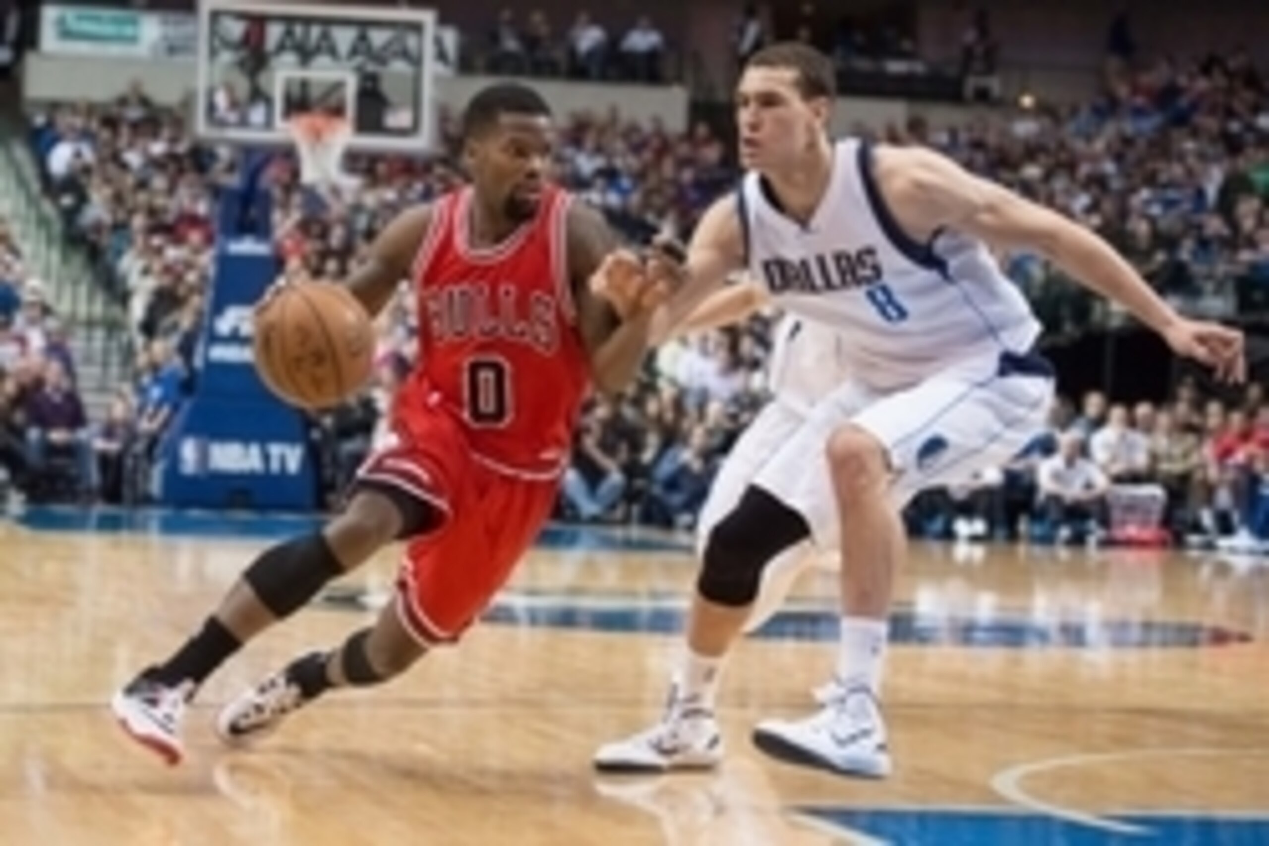 Jan 23, 2015; Dallas, TX, USA; Dallas Mavericks forward Dwight Powell (8) guards Chicago Bulls guard Aaron Brooks (0) during the game at the American Airlines Center. The Bulls defeated the Mavericks 102-98. Mandatory Credit: Jerome Miron-USA TODAY Sports