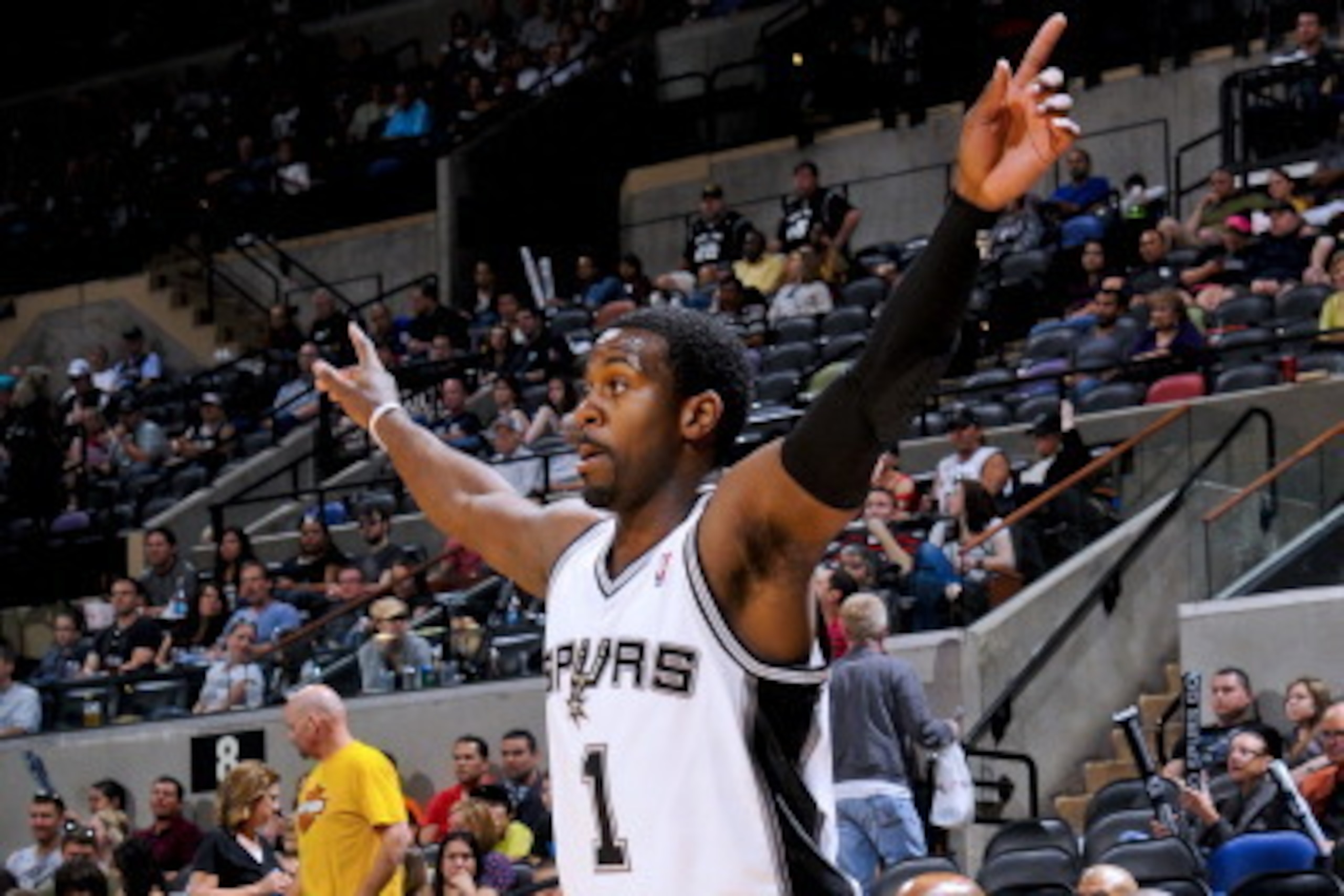 SAN ANTONIO, TX - MARCH 25: Justin Dentmon #1 of the San Antonio Spurs celebrates during a game against the Philadelphia 76ers at the AT&T Center on March 25, 2012 in San Antonio, Texas. NOTE TO USER: User expressly acknowledges and agrees that, by downlo SAN ANTONIO, TX - MARCH 25: Justin Dentmon #1 of the San Antonio Spurs celebrates during a game against the Philadelphia 76ers at the AT&T Center on March 25, 2012 in San Antonio, Texas. NOTE TO USER: User expressly acknowledges and agrees that, by downlo