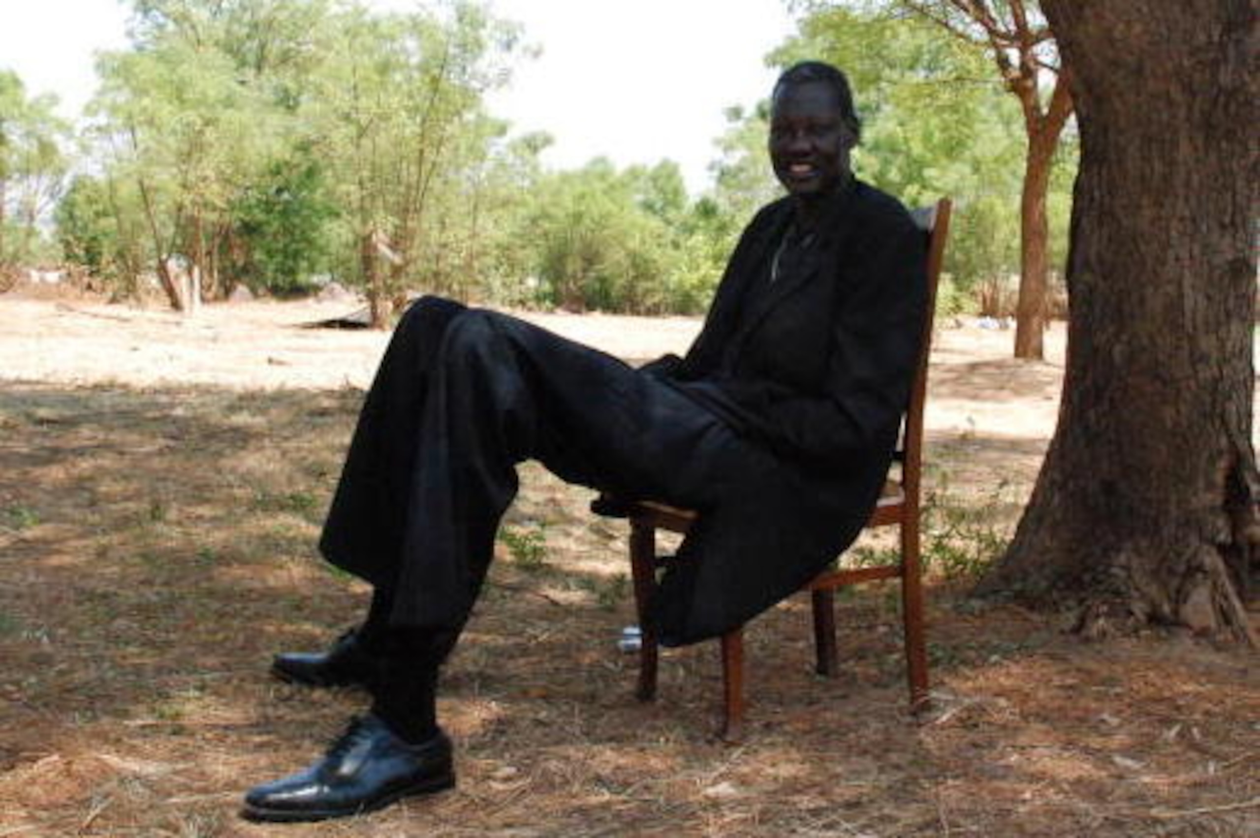 TO GO WITH AFP STORY BY PETER MARTELL Sudanese former NBA star Manute Bol sits in the southern Sudanese capital of Juba on February 16, 2009. Bol has good reason to be angry: in Sudan's north-south civil war, more than 250 family members were killed and h