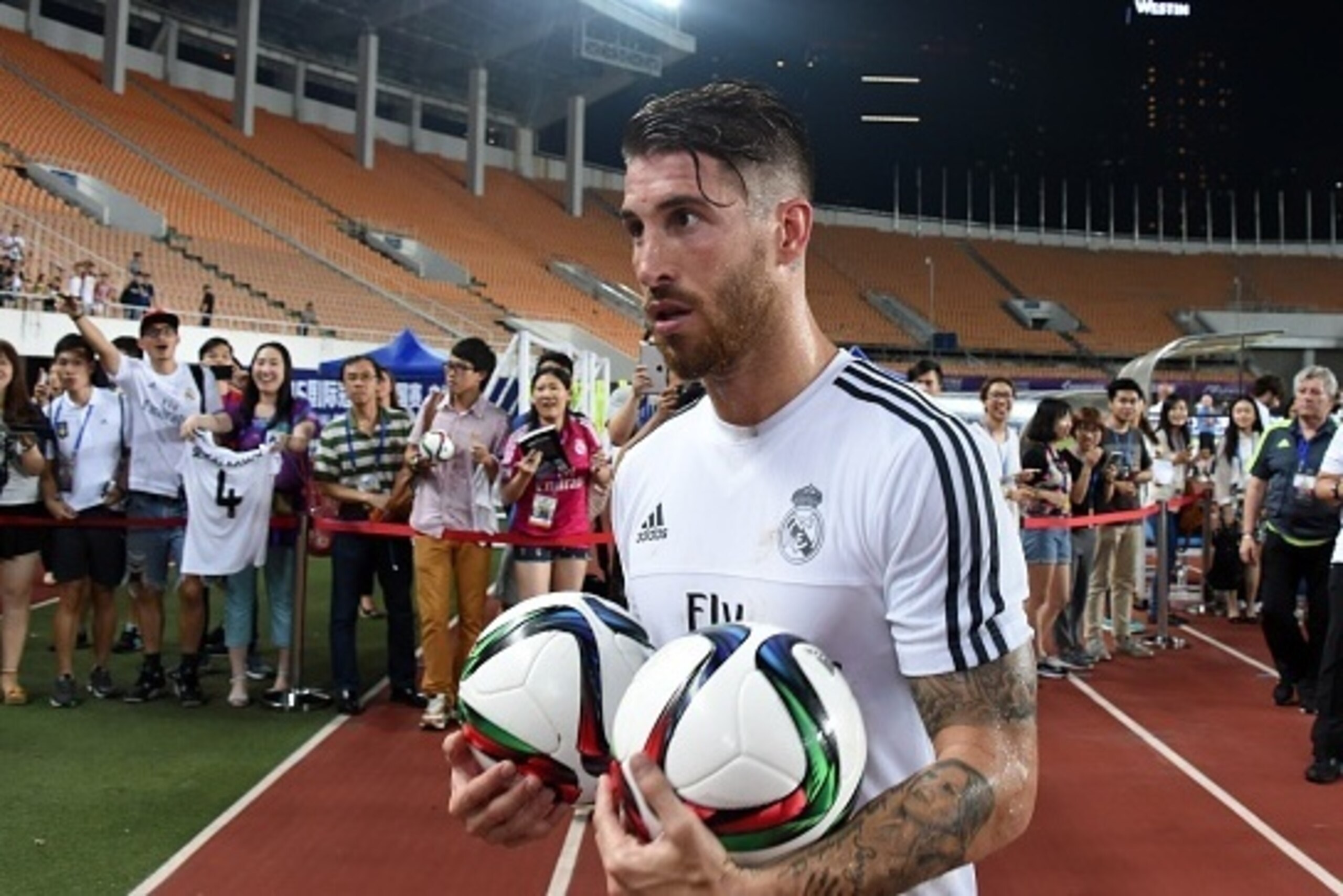 Real Madrid's defender Sergio Ramos holds two ball after a training session on the eve of the International Champions Cup football match between Inter Milan and Real Madrid in Guagnzhou on July 26, 2015. AFP PHOTO / JOHANNES EISELE (Photo credit s Real Madrid's defender Sergio Ramos holds two ball after a training session on the eve of the International Champions Cup football match between Inter Milan and Real Madrid in Guagnzhou on July 26, 2015. AFP PHOTO / JOHANNES EISELE (Photo credit s
