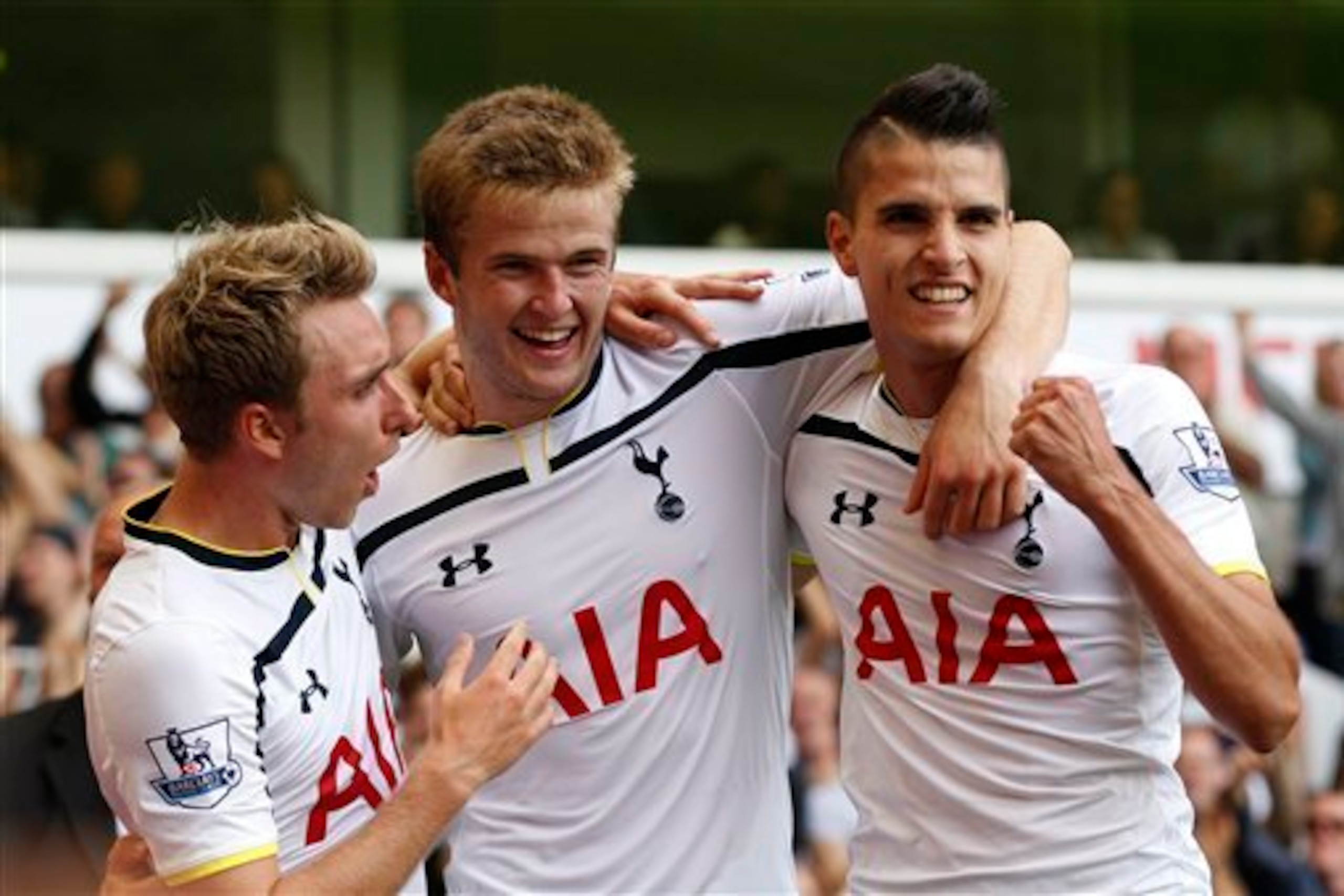 Dier is congratulated by his new team-mates Christian Eriksen and Erik Lamela after scoring in the 4-0 win over QPR last season.