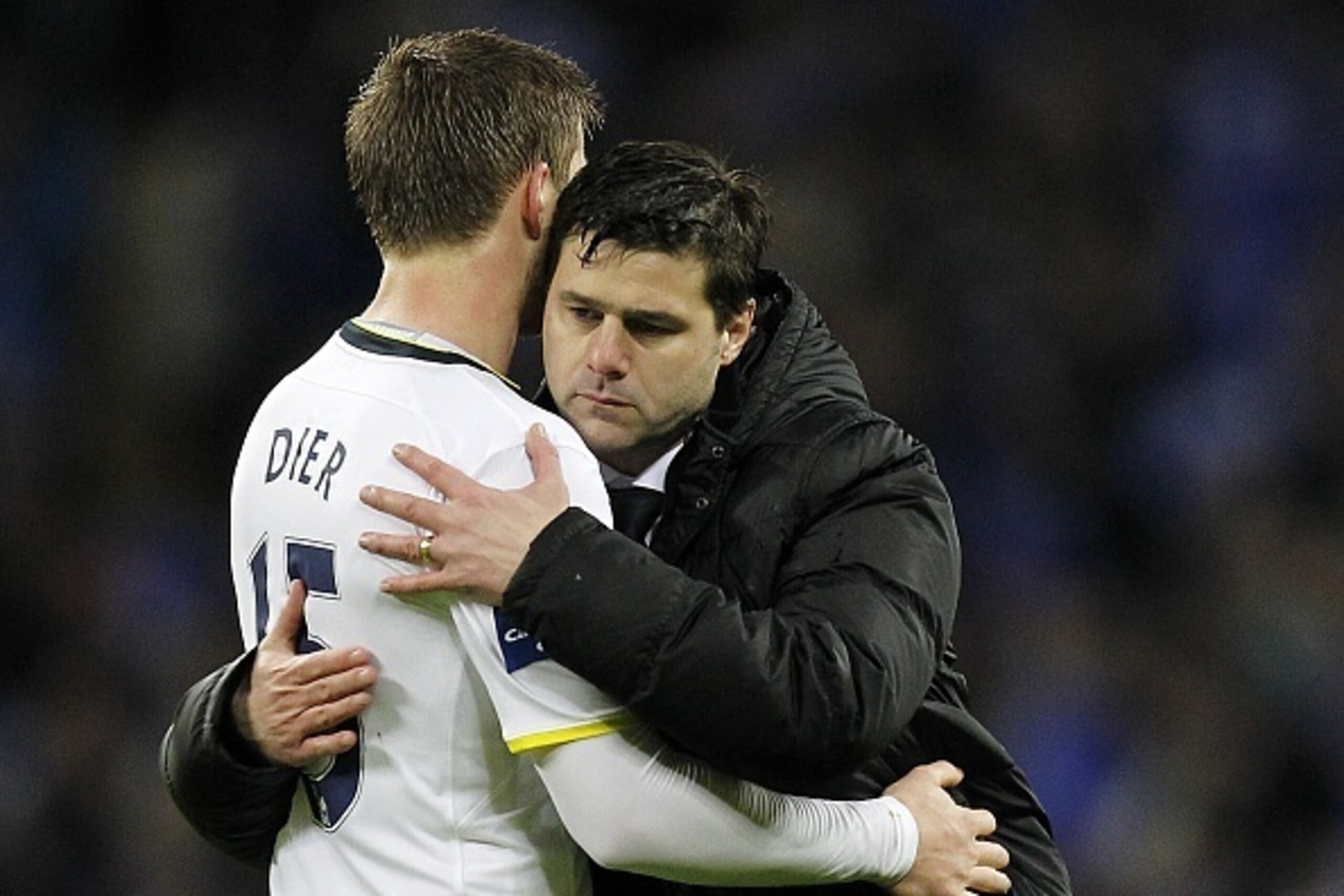 Tottenham Hotspur's Argentinian Head Coach Mauricio Pochettino (R) consoles Tottenham Hotspur's English defender Eric Dier after the English League Cup Final football match between Chelsea and Tottenham Hotspur at Wembley Stadium in north London on March 